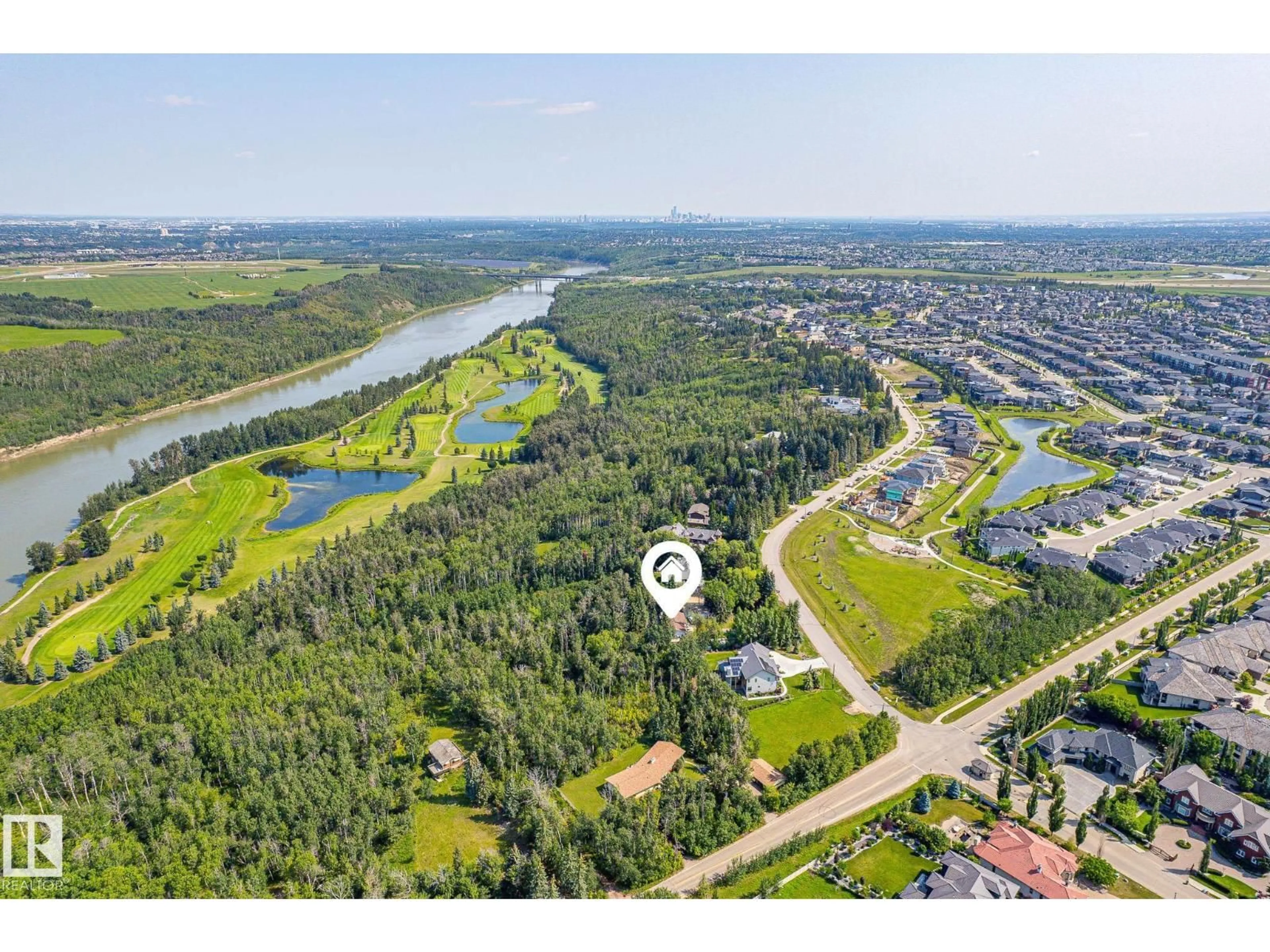 A pic from outside/outdoor area/front of a property/back of a property/a pic from drone, water/lake/river/ocean view for 108 WINDERMERE DR, Edmonton Alberta T6W0S4