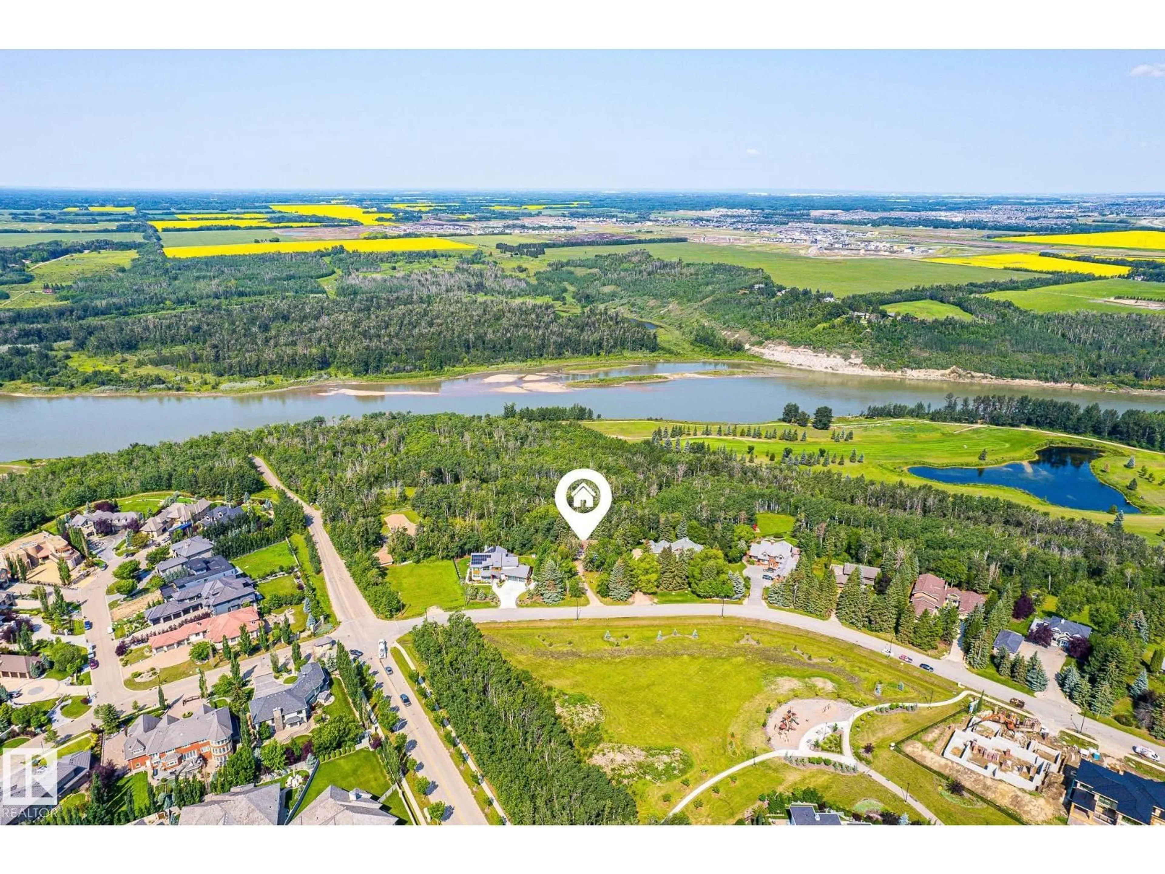 A pic from outside/outdoor area/front of a property/back of a property/a pic from drone, water/lake/river/ocean view for 108 WINDERMERE DR, Edmonton Alberta T6W0S4
