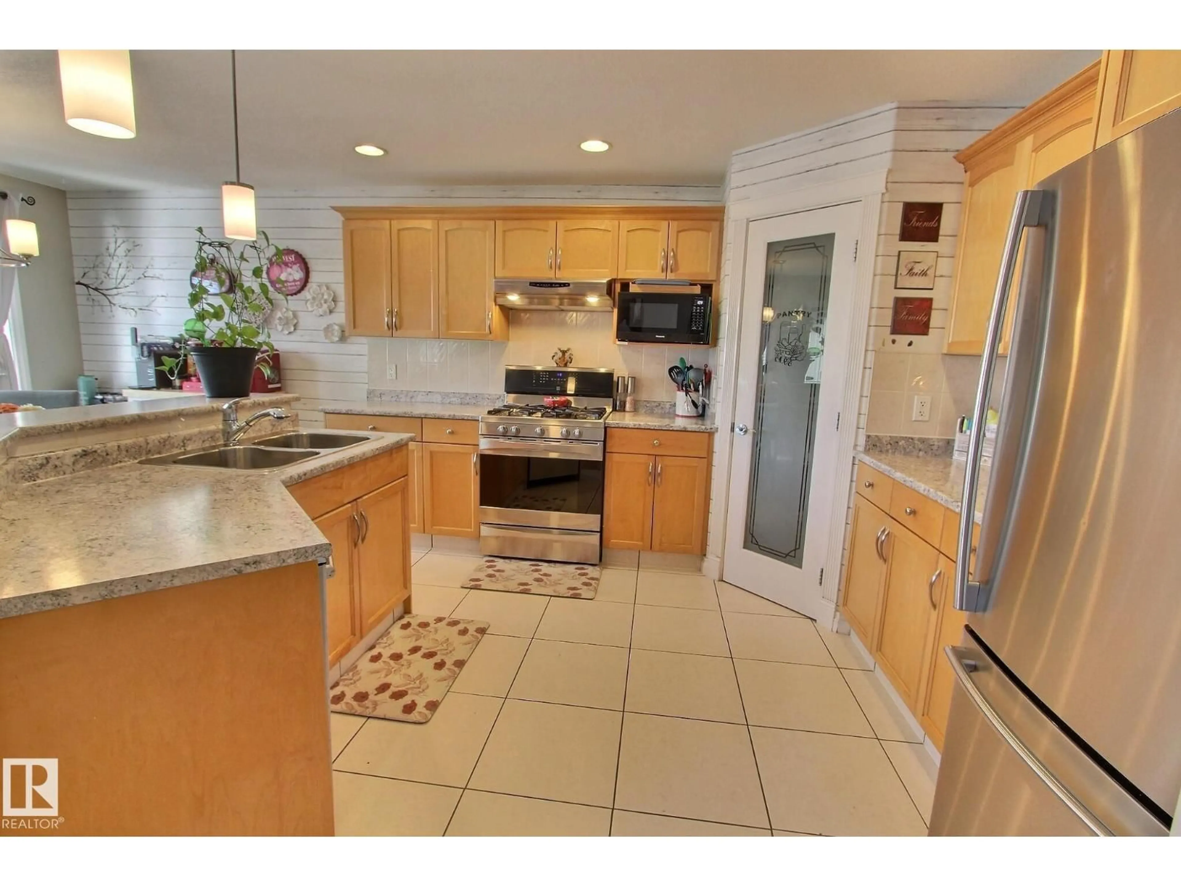 Open concept kitchen, ceramic/tile floor for 12 BIRCHMONT CR, Leduc Alberta T9E8S3