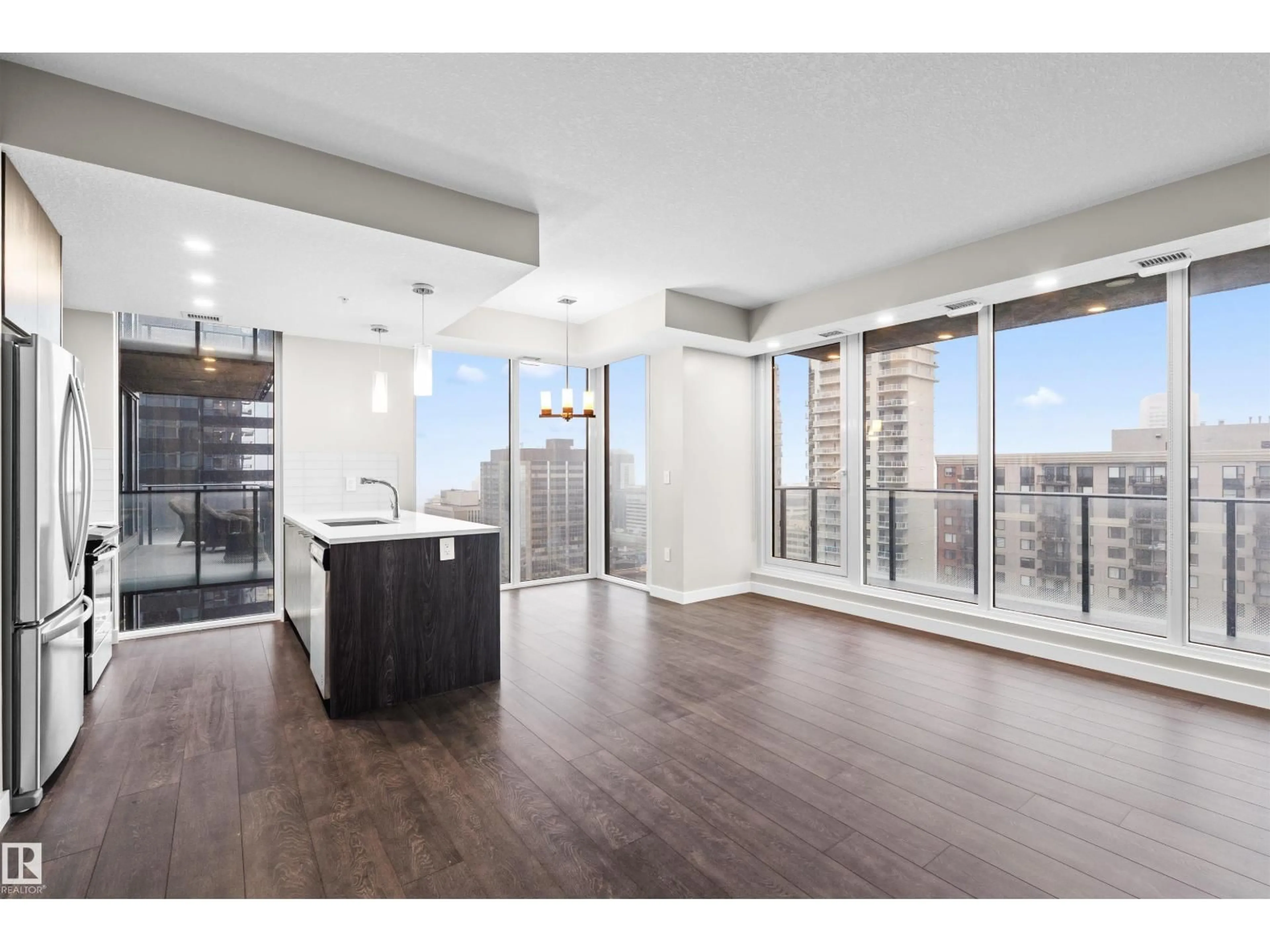 Open concept kitchen, wood/laminate floor for 2201 10180 103 ST NW, Edmonton Alberta T5J0L1