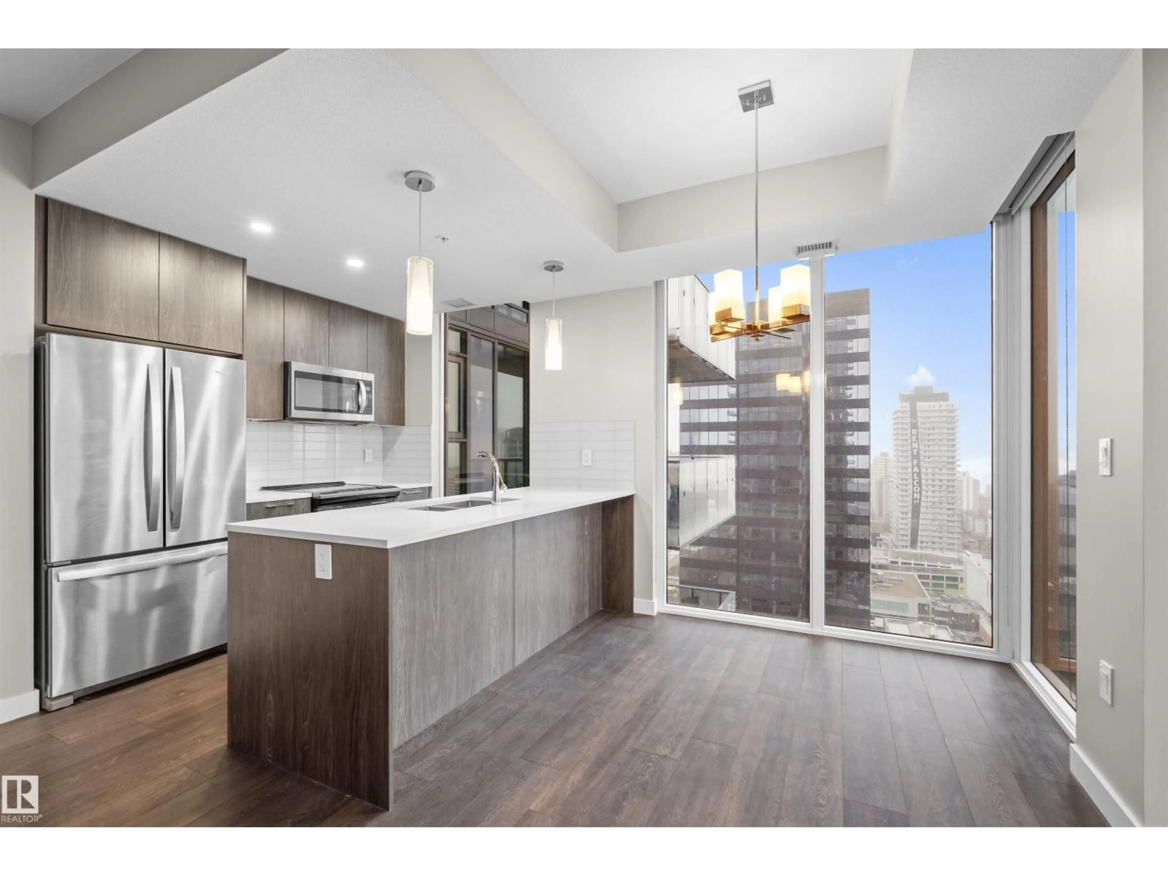 Open concept kitchen, wood/laminate floor for 2201 10180 103 ST NW, Edmonton Alberta T5J0L1