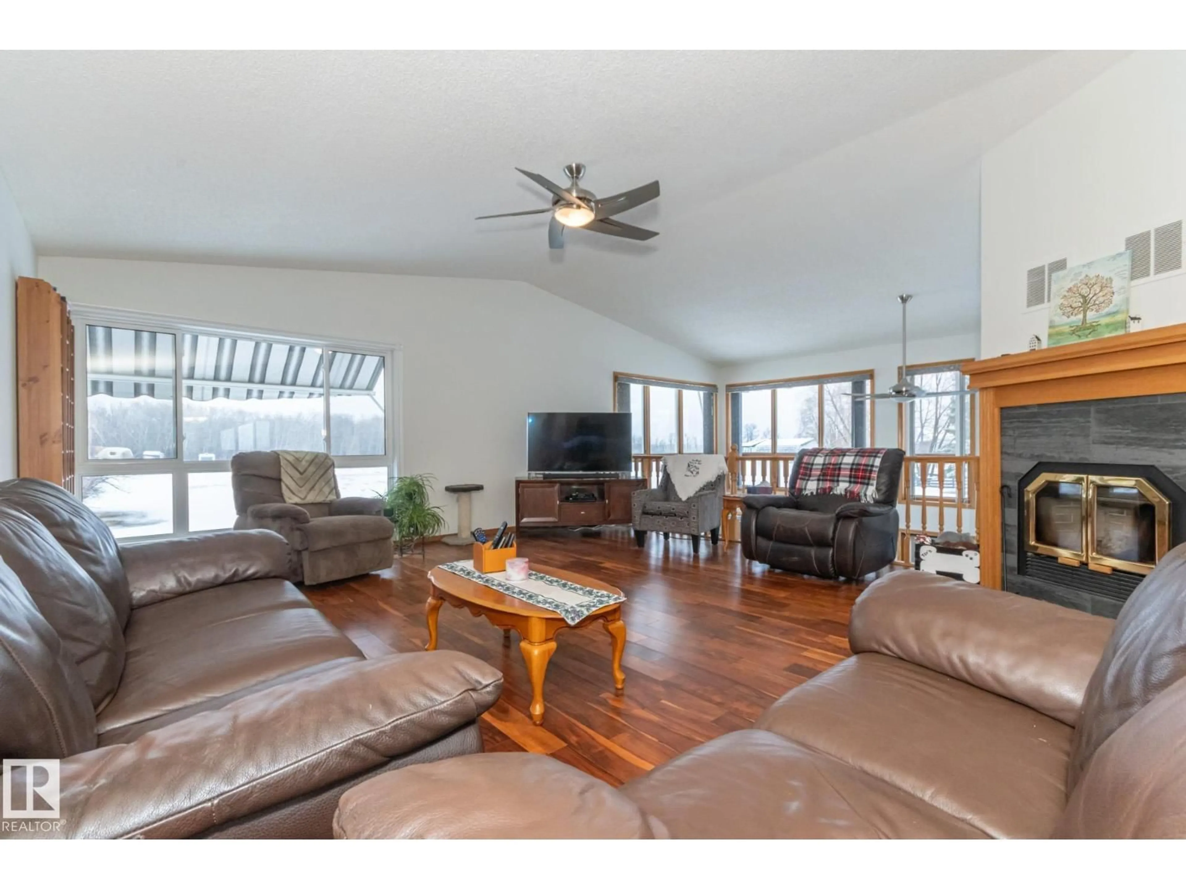 Living room with furniture, wood/laminate floor for 181 52349 RGE ROAD 222, Rural Strathcona County Alberta T8C1A4