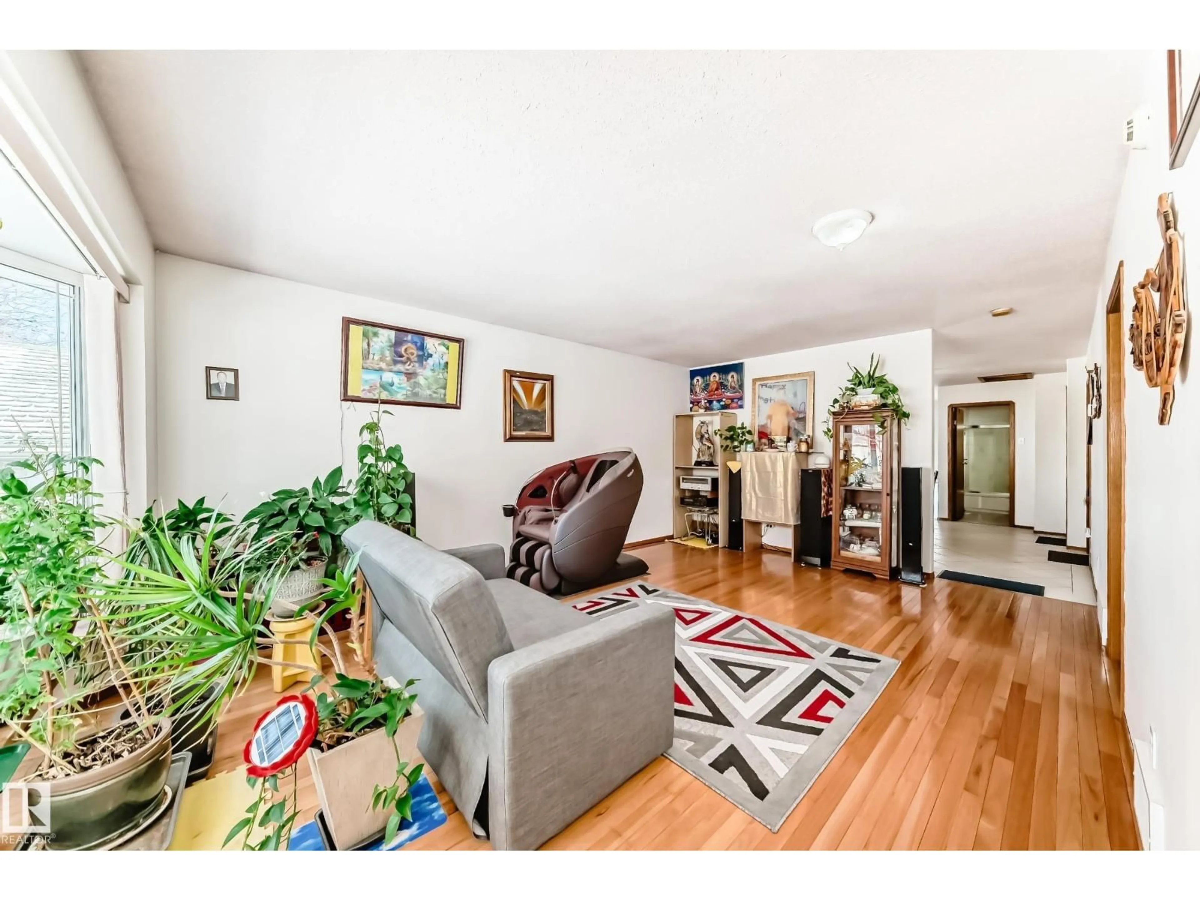 Living room with furniture, wood/laminate floor for 11913 80 ST, Edmonton Alberta T5B2N8