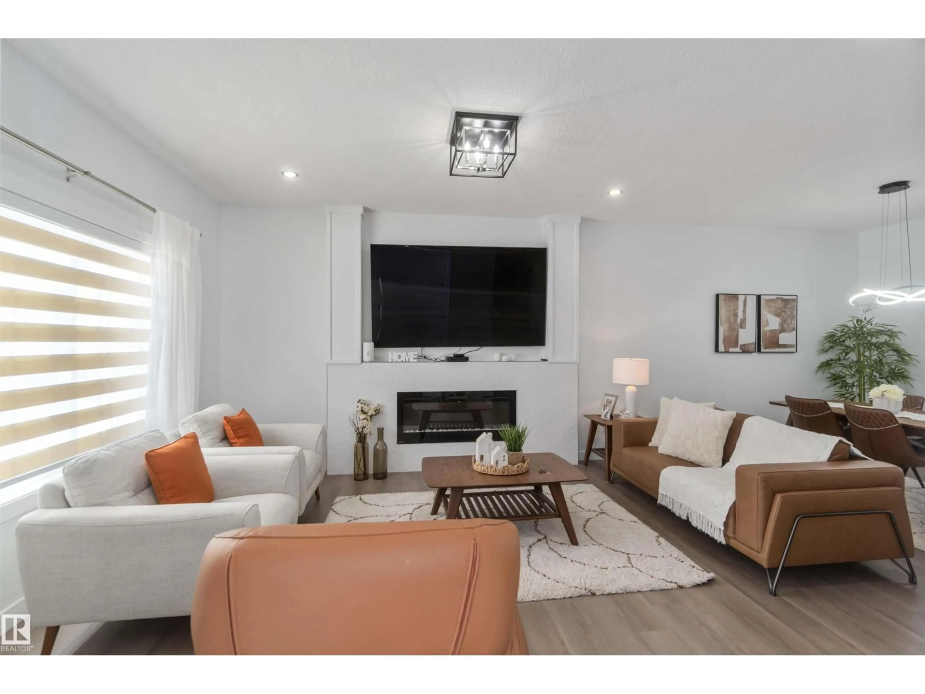 Living room with furniture, wood/laminate floor for SW - 124 28 ST, Edmonton Alberta T6A3L2