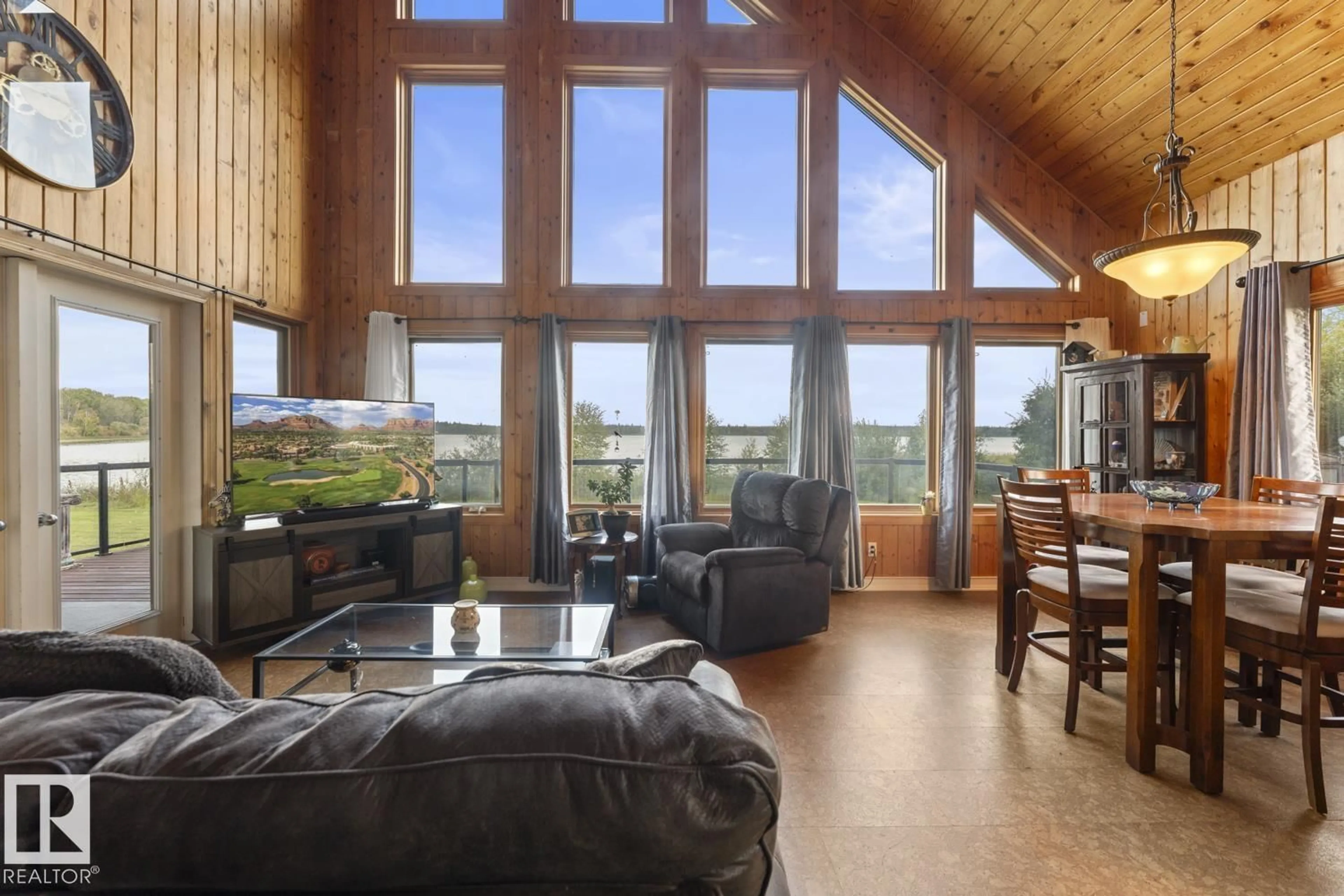 Living room with furniture, wood/laminate floor for 43123 TWP RD 642 A, Rural Bonnyville M.D. Alberta T9M1P3