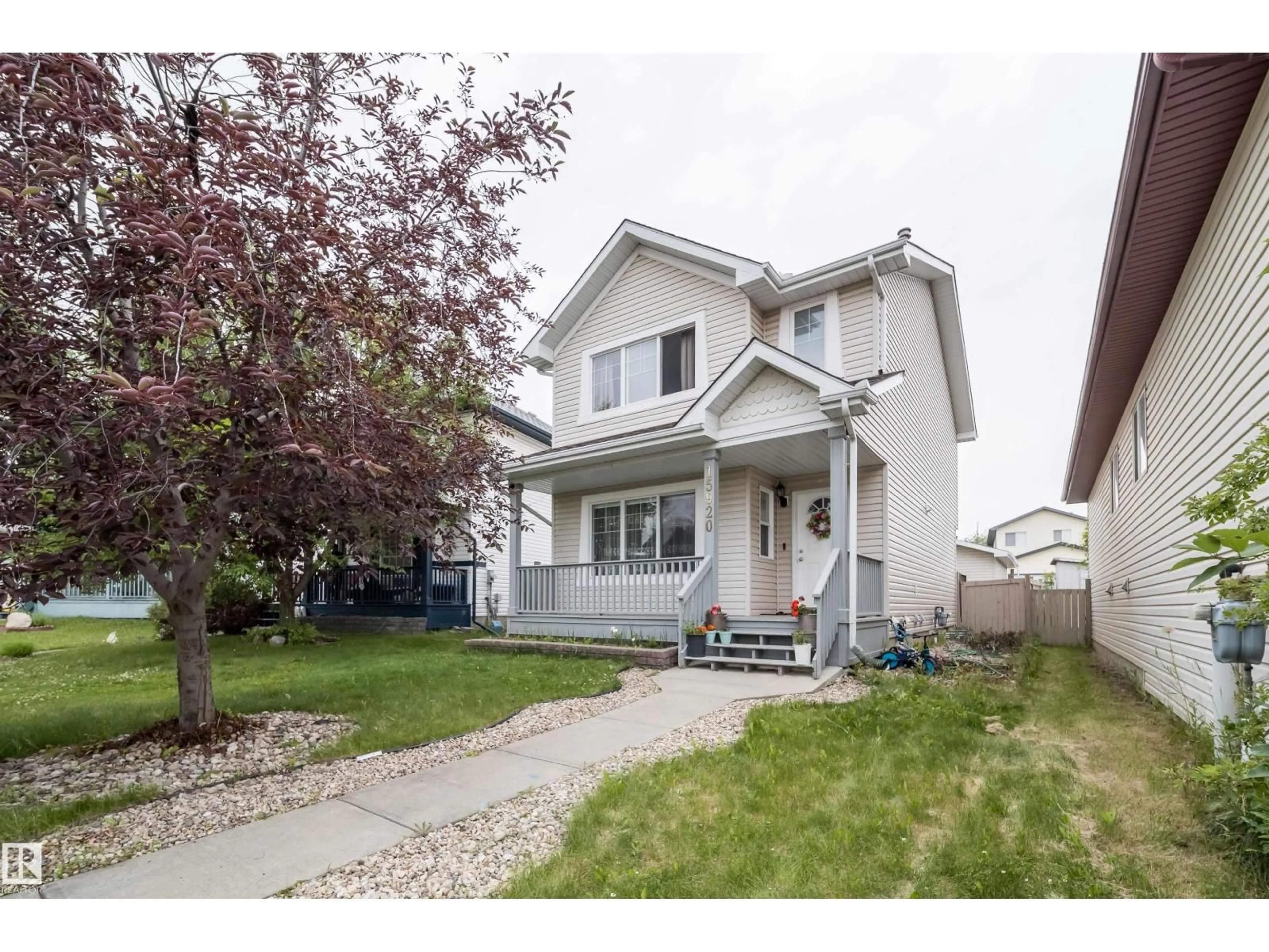 Home with vinyl exterior material, street for 15920 38 ST, Edmonton Alberta T5Y3E9