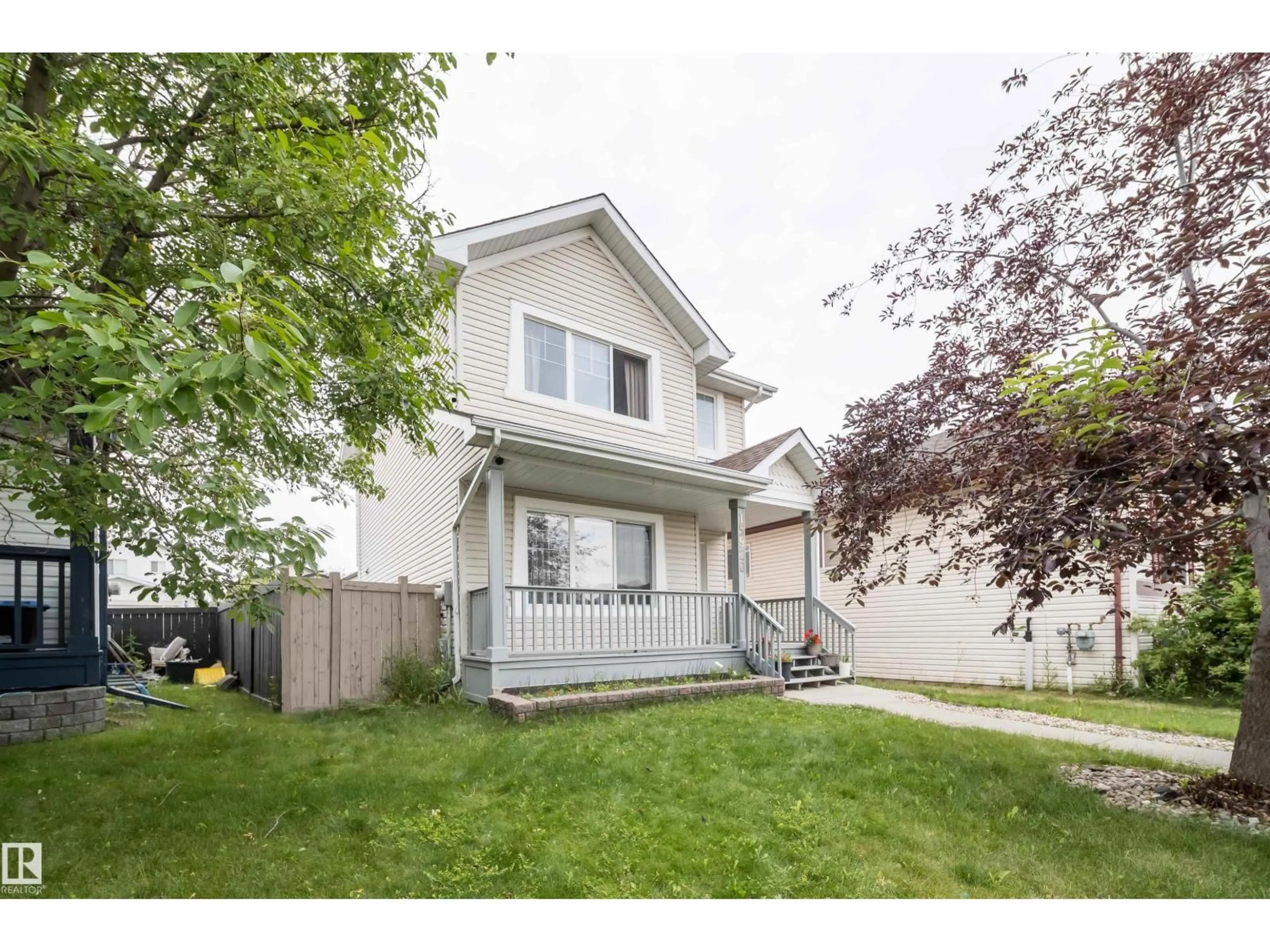 Home with vinyl exterior material, street for 15920 38 ST, Edmonton Alberta T5Y3E9