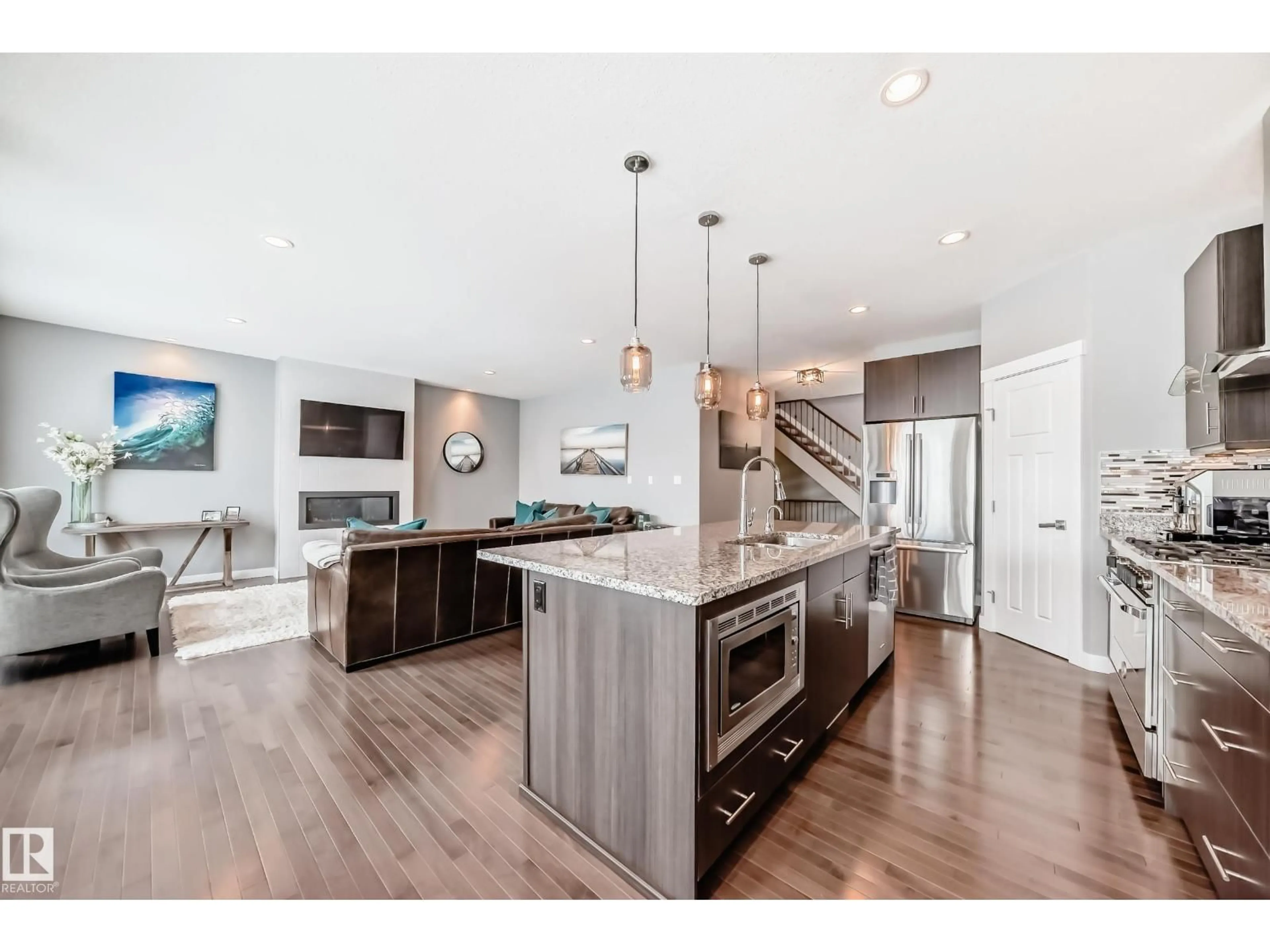 Open concept kitchen, wood/laminate floor for SW - 2117 69A ST, Edmonton Alberta T6X0S7