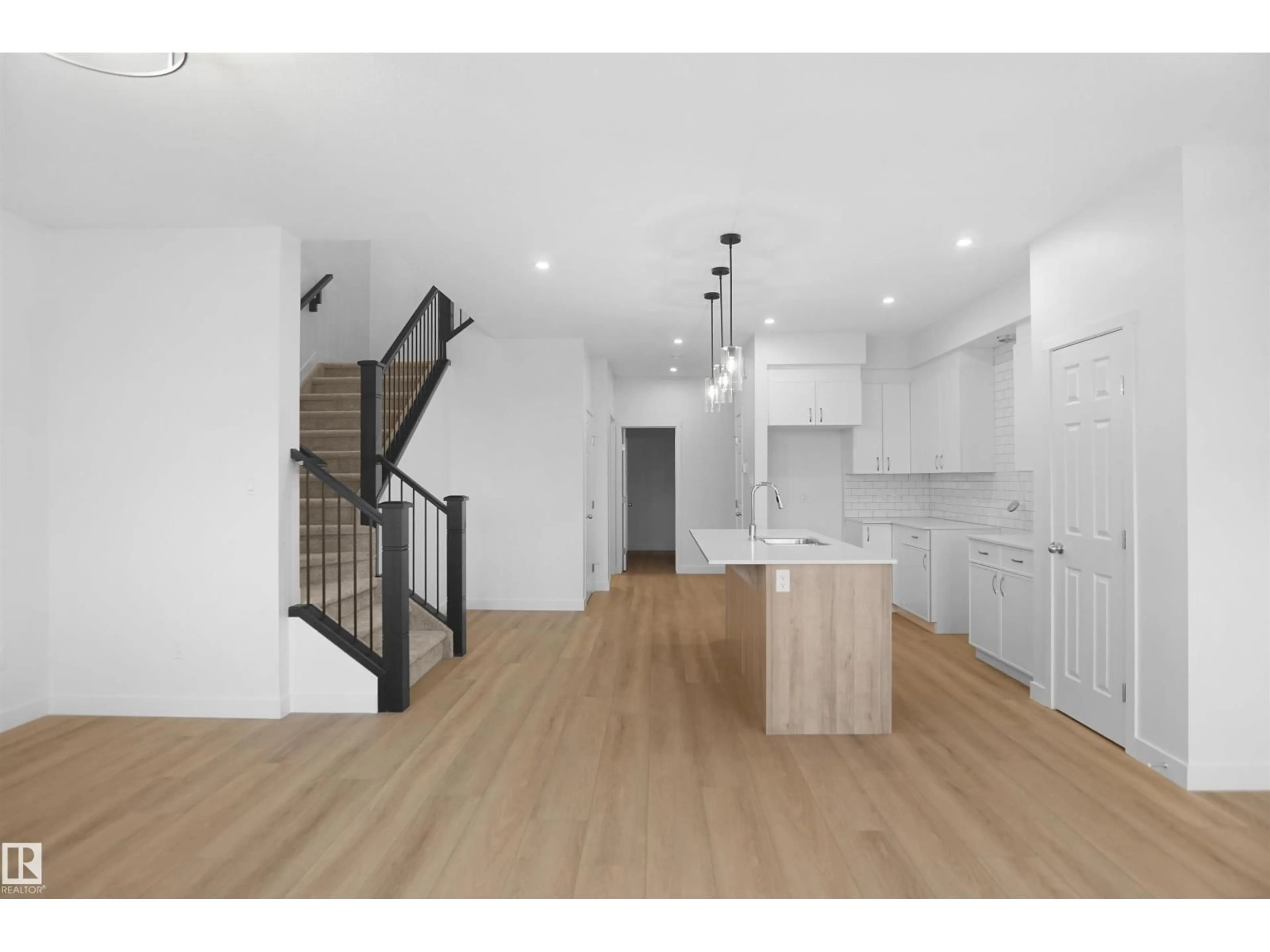 Open concept kitchen, wood/laminate floor for 19446 22A AV, Edmonton Alberta T6M1P9