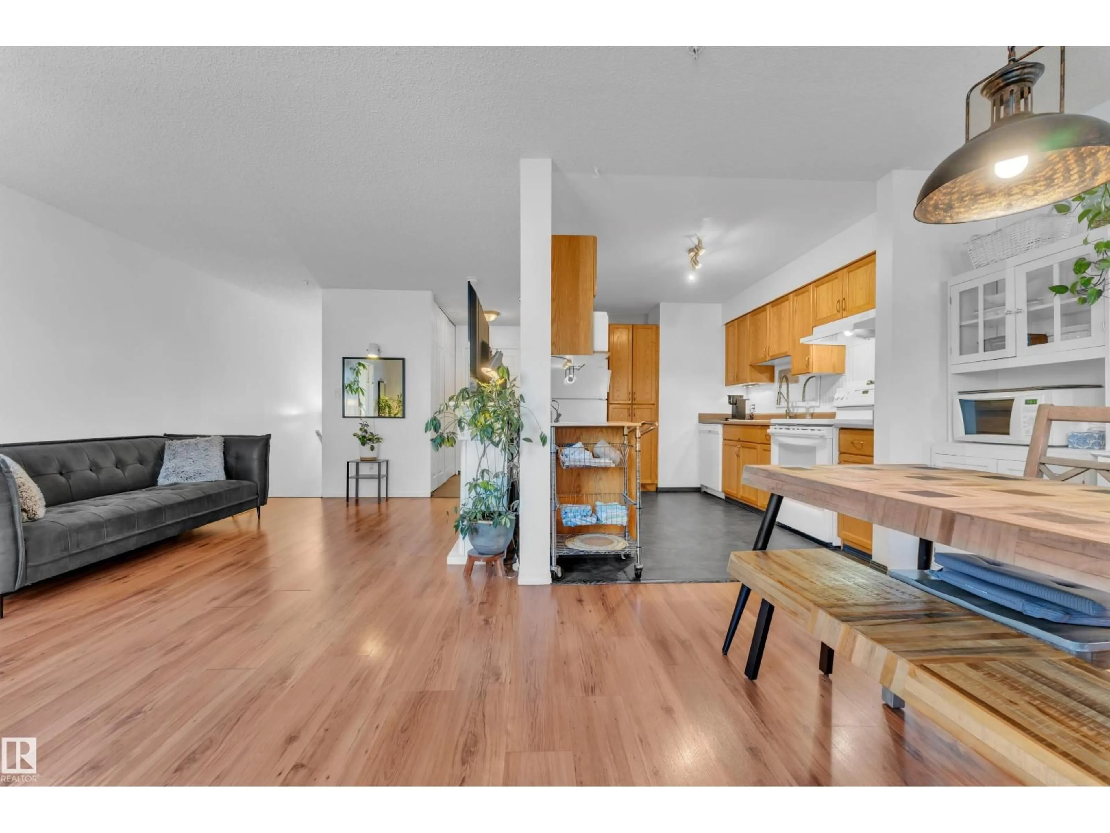 Open concept kitchen, wood/laminate floor for 105 - 114 MCKENNEY AVE, St. Albert Alberta T8N2Y2
