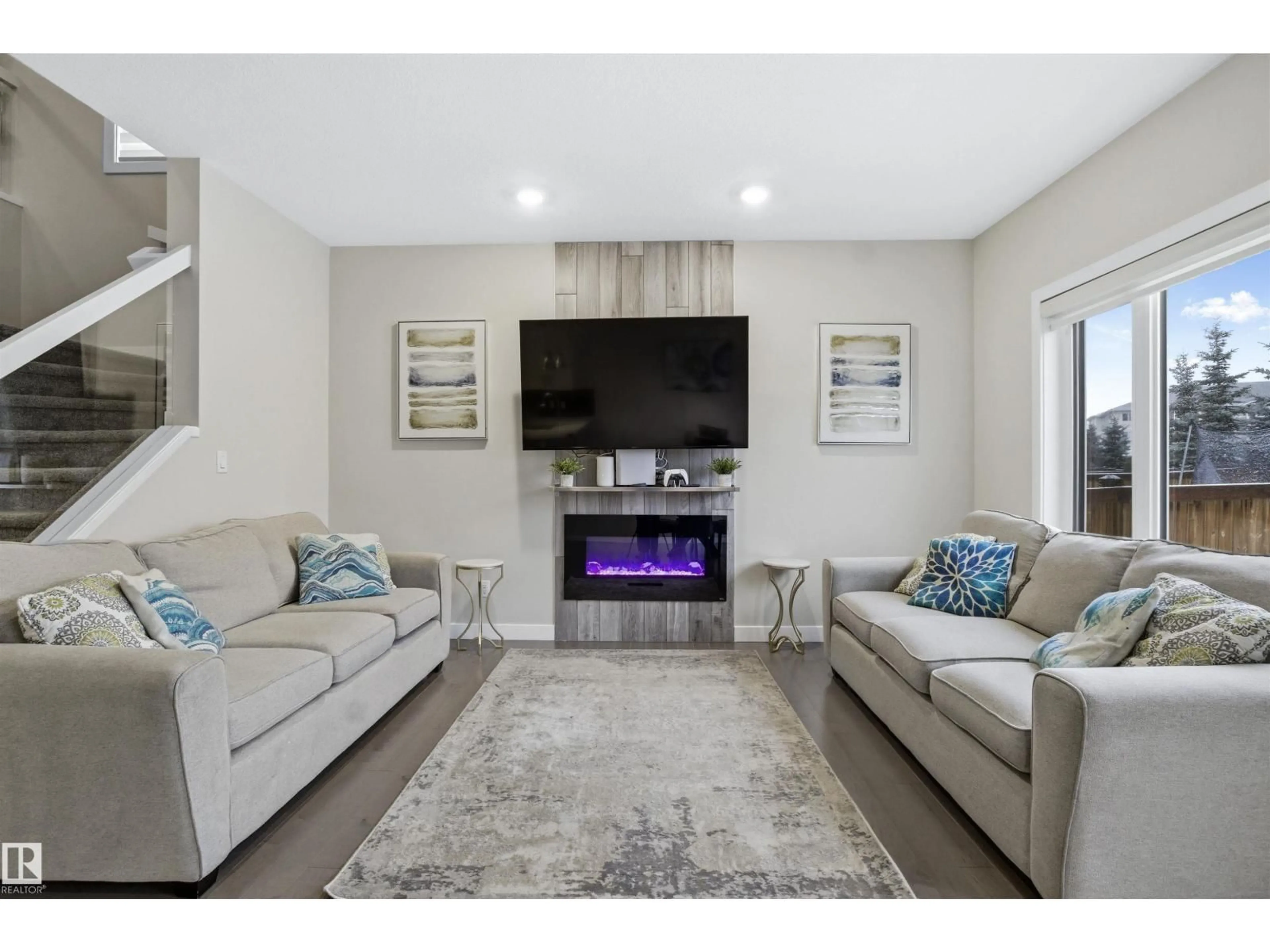 Living room with furniture, unknown for NW - 6106 171 AV, Edmonton Alberta T5Y3S4