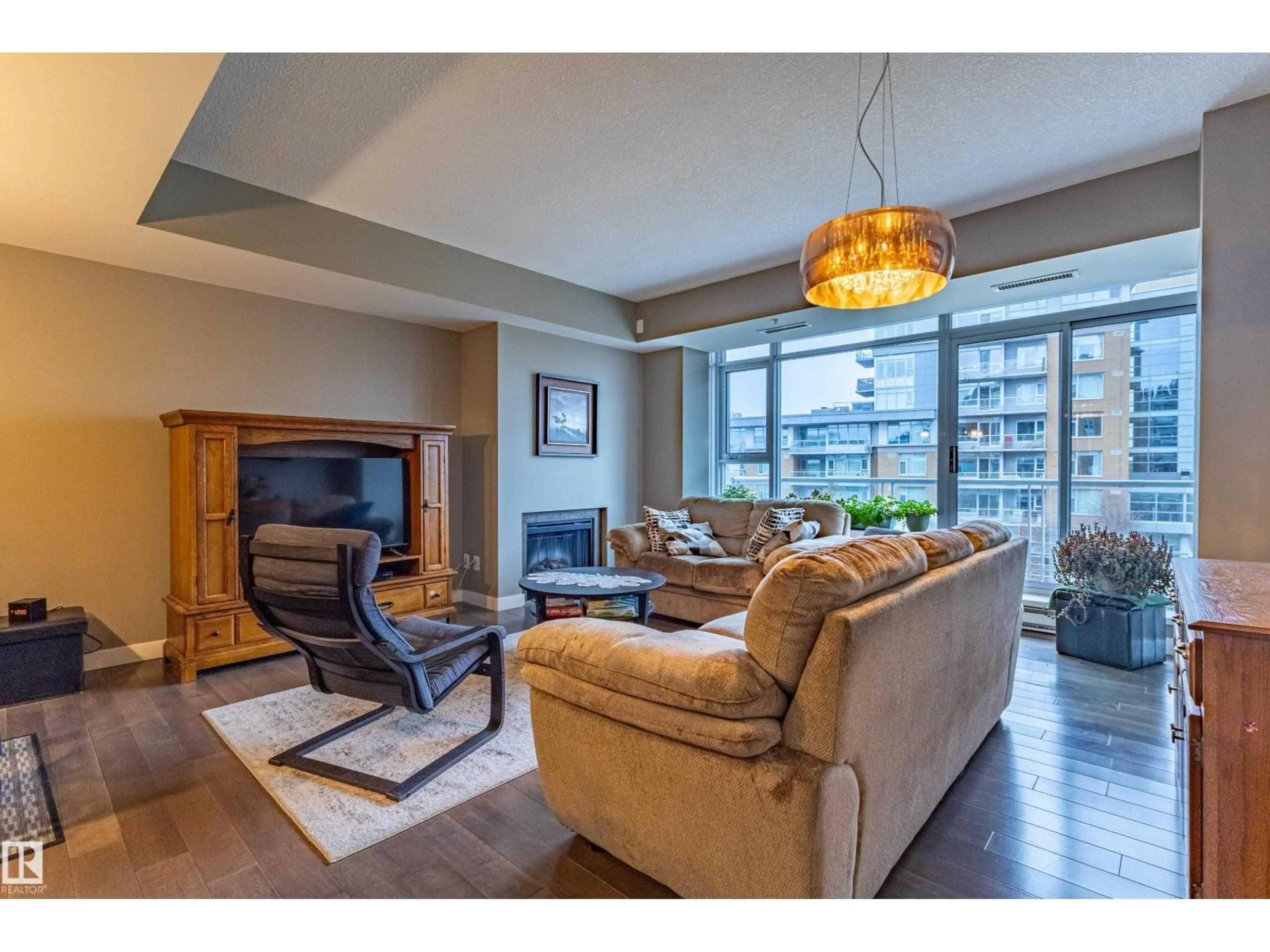 Living room with furniture, unknown for 310 - 2510 109 ST NW, Edmonton Alberta T6J2X1