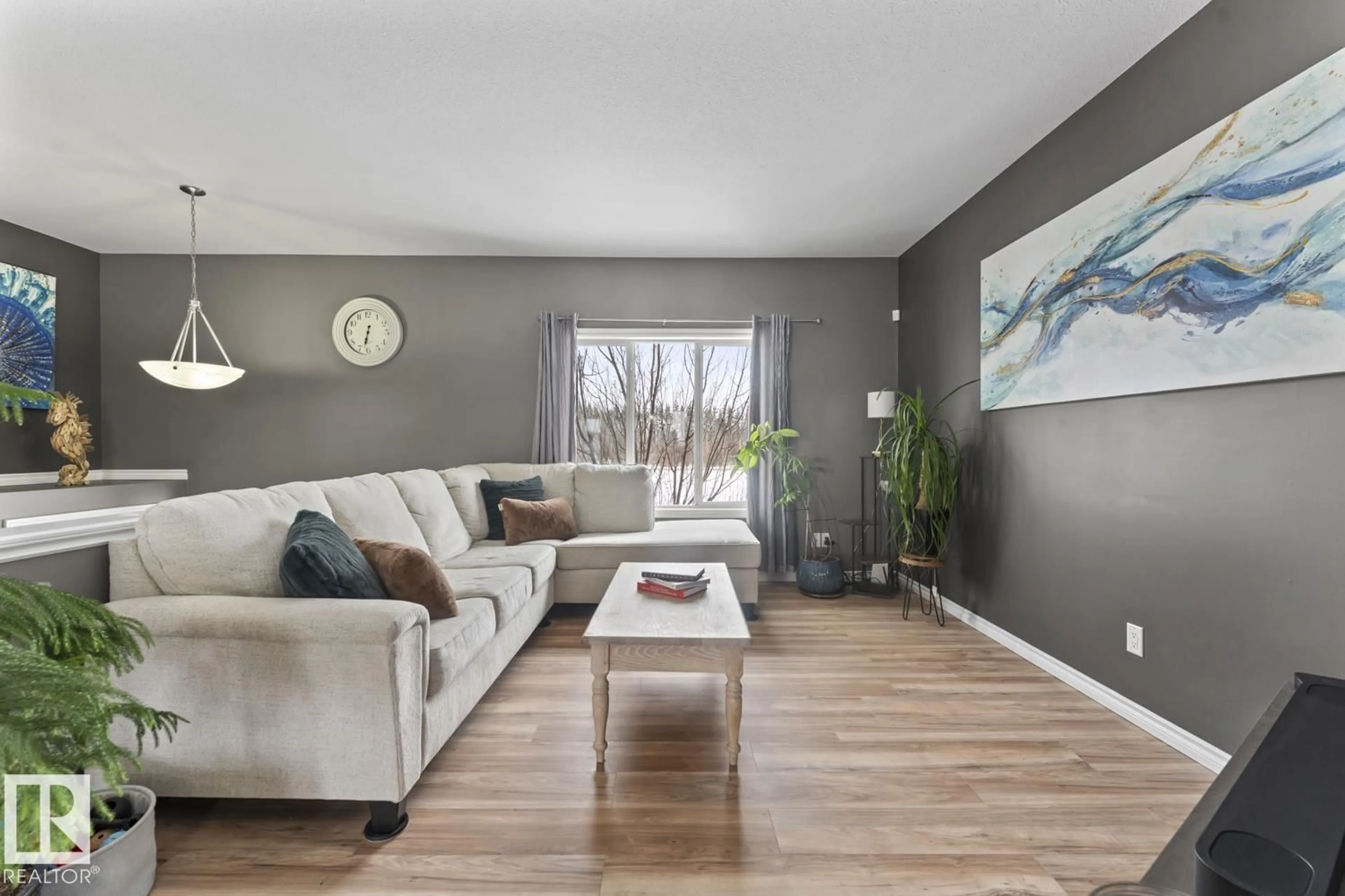 Living room with furniture, wood/laminate floor for 42228B TWP RD 632, Rural Bonnyville M.D. Alberta T9M1P1