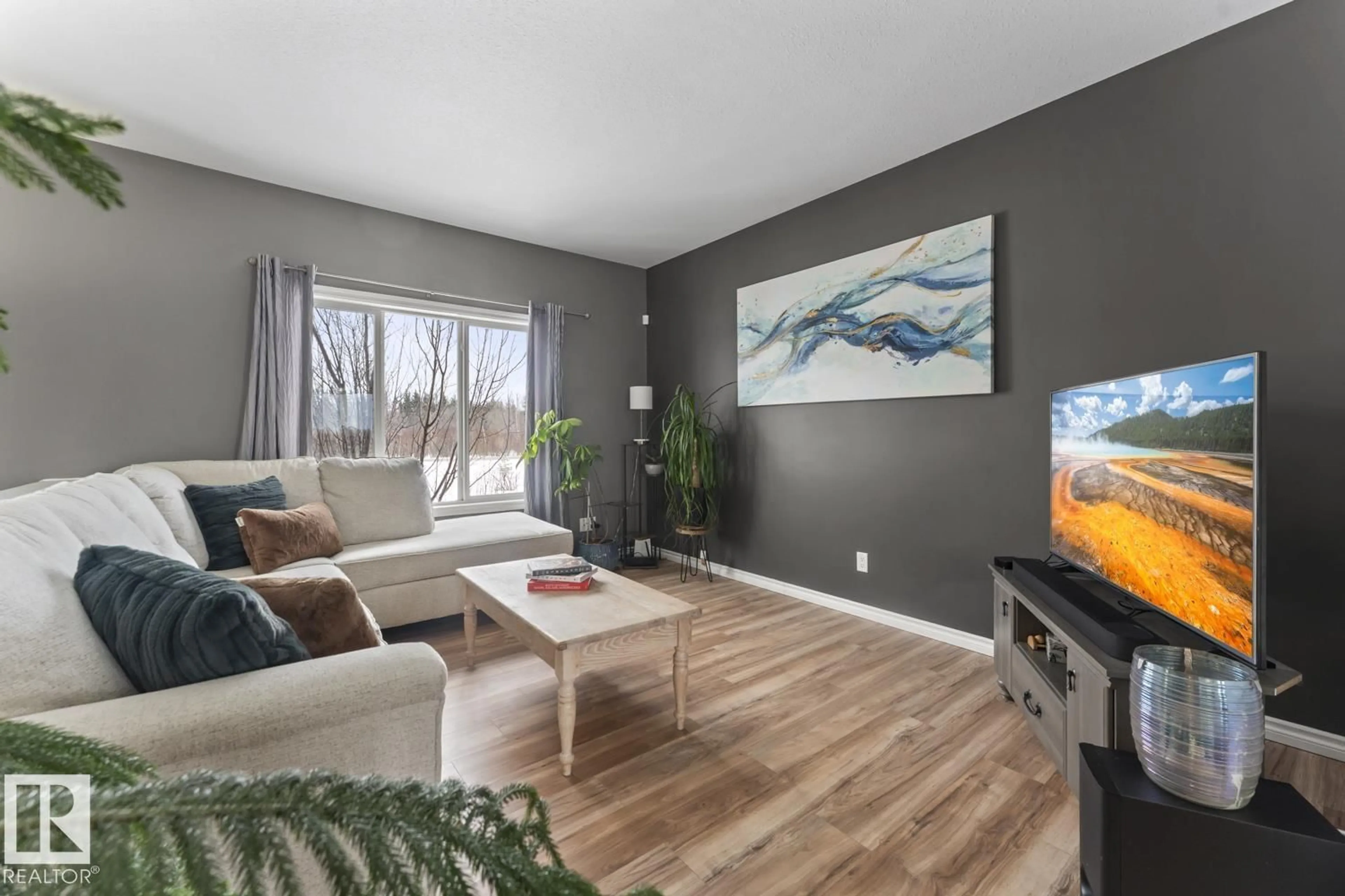 Living room with furniture, wood/laminate floor for 42228B TWP RD 632, Rural Bonnyville M.D. Alberta T9M1P1