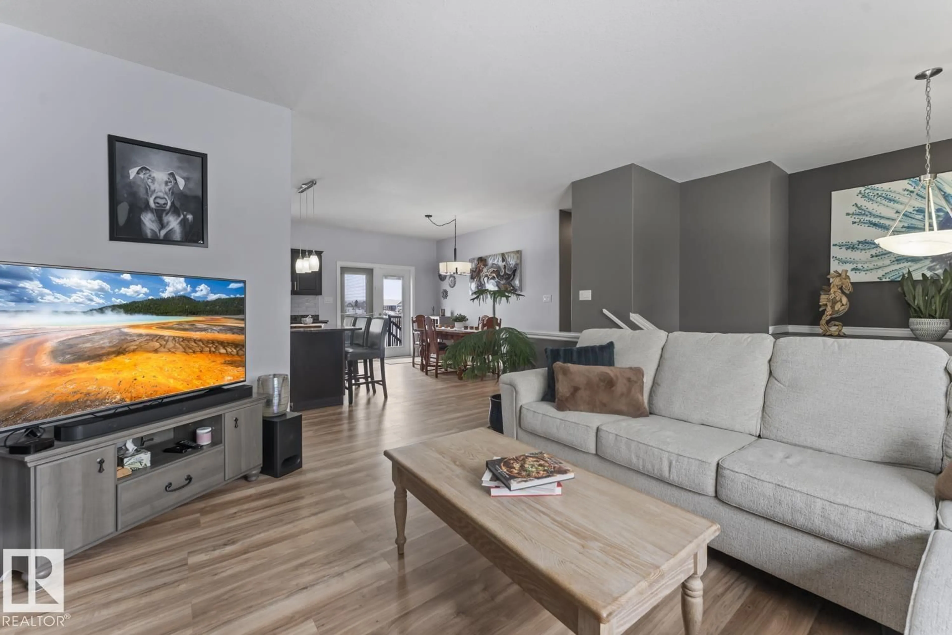 Living room with furniture, wood/laminate floor for 42228B TWP RD 632, Rural Bonnyville M.D. Alberta T9M1P1