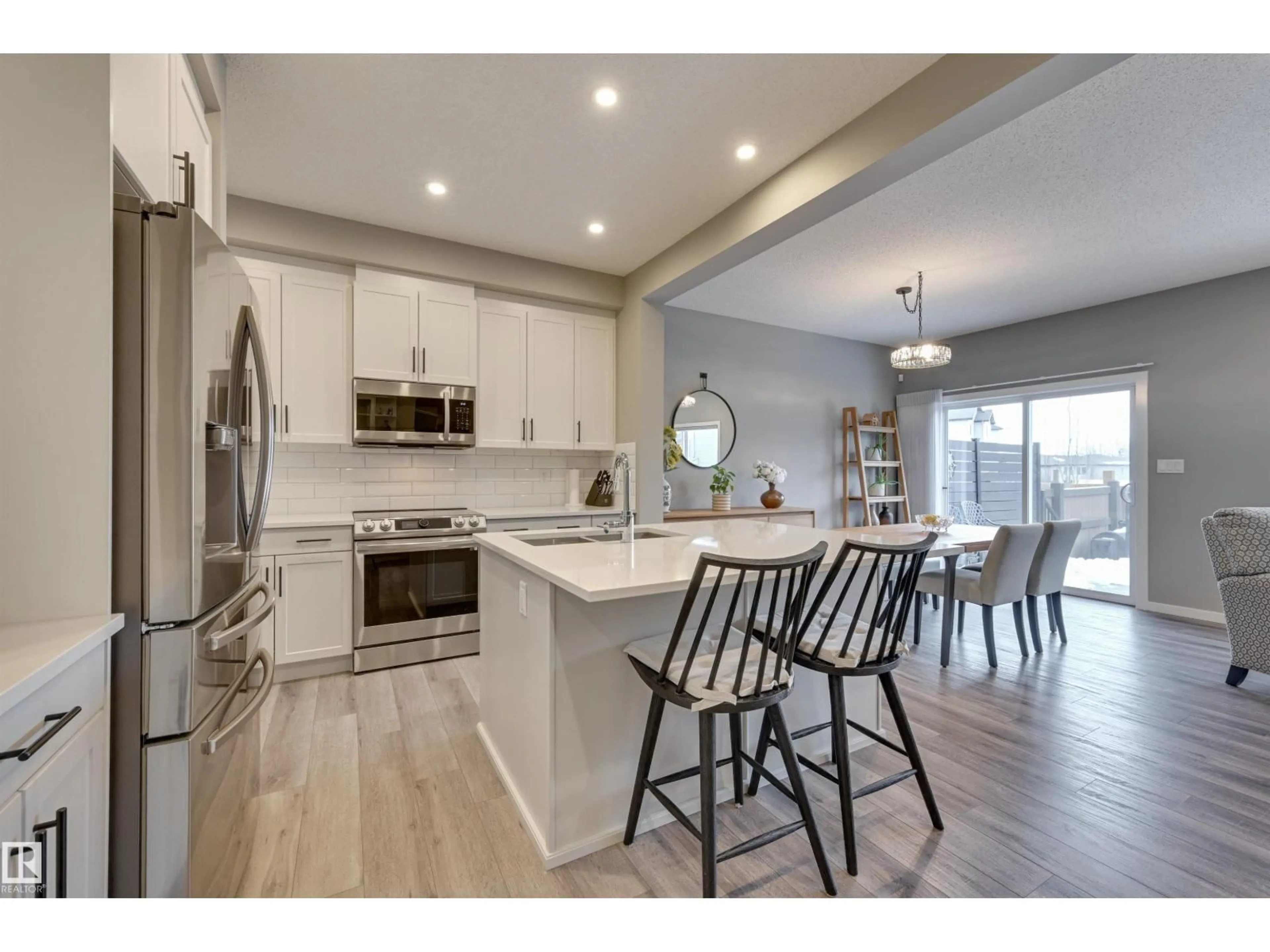 Open concept kitchen, wood/laminate floor for 5158 LARK CR, Edmonton Alberta T5S0P2
