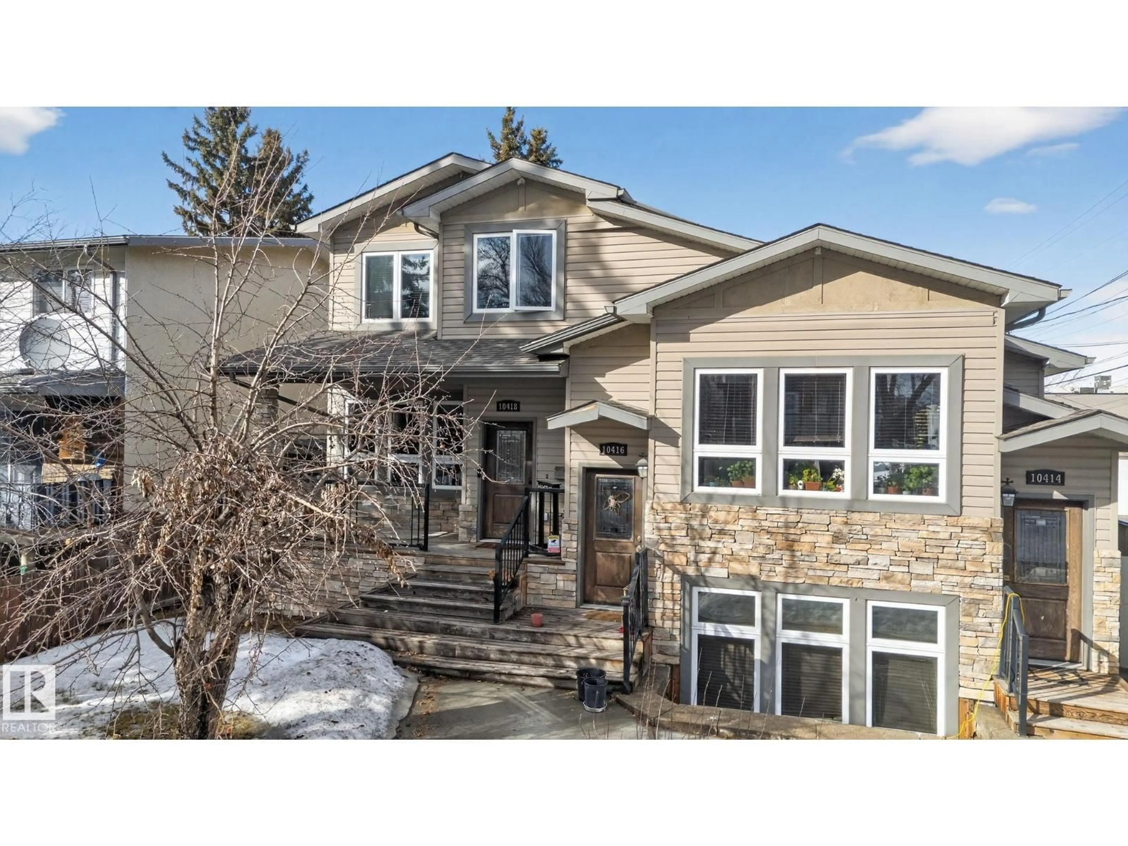 Home with vinyl exterior material, street for NW - 10418 69 AV, Edmonton Alberta T6H2C3