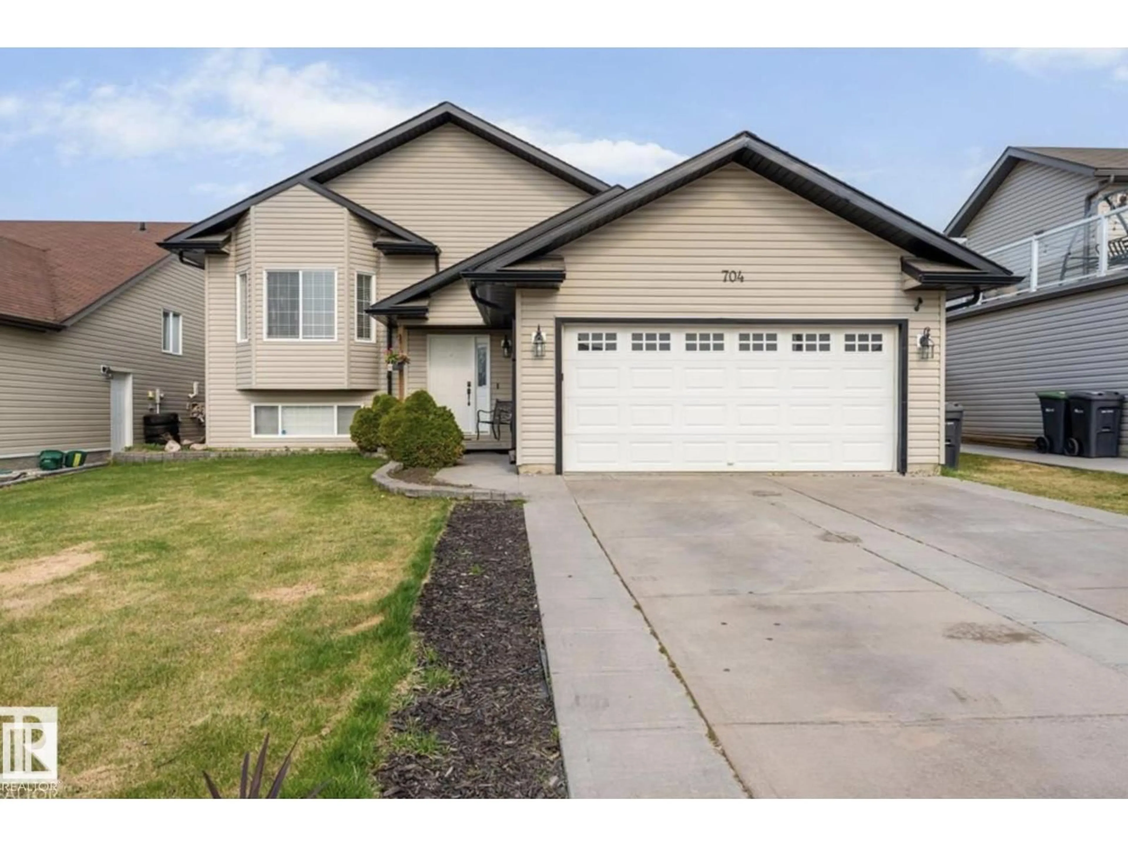 Home with vinyl exterior material, street for 704 GROUSE CL, Cold Lake Alberta T9M0A5