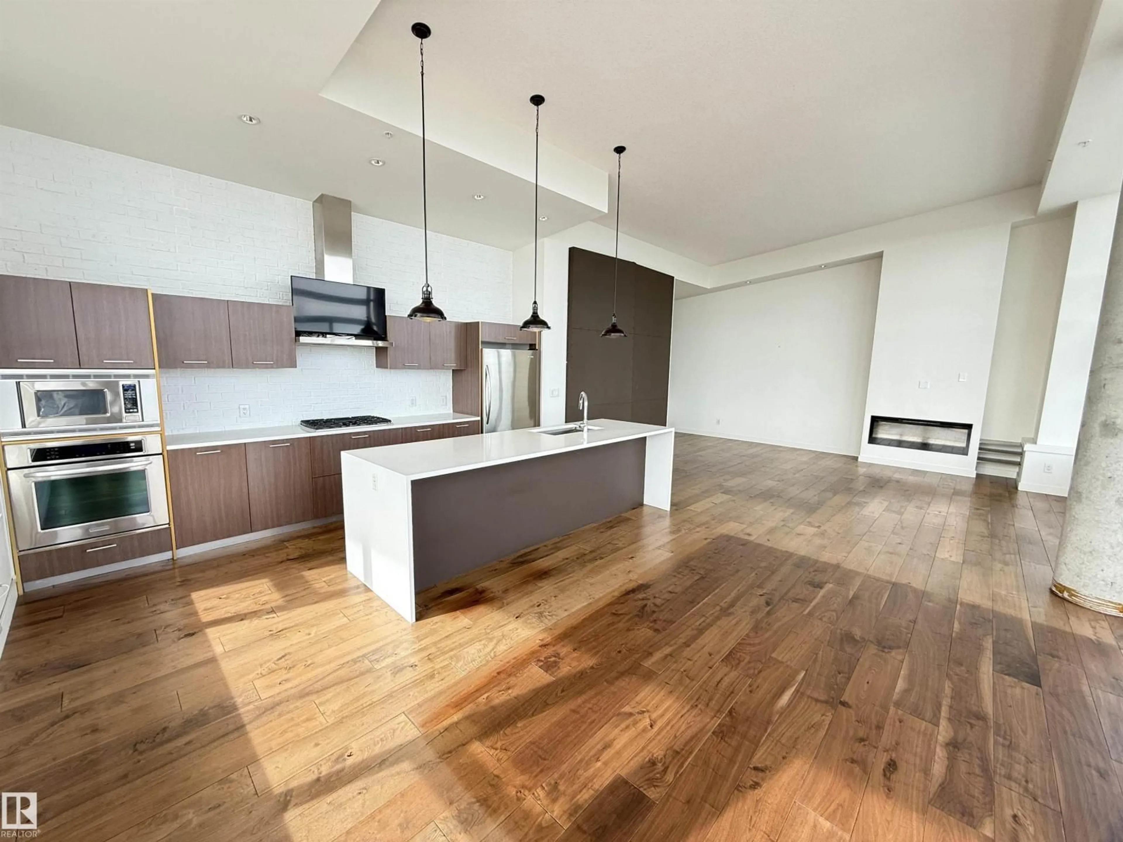Open concept kitchen, wood/laminate floor for 710 - 2504 109 ST NW, Edmonton Alberta T6J2H3