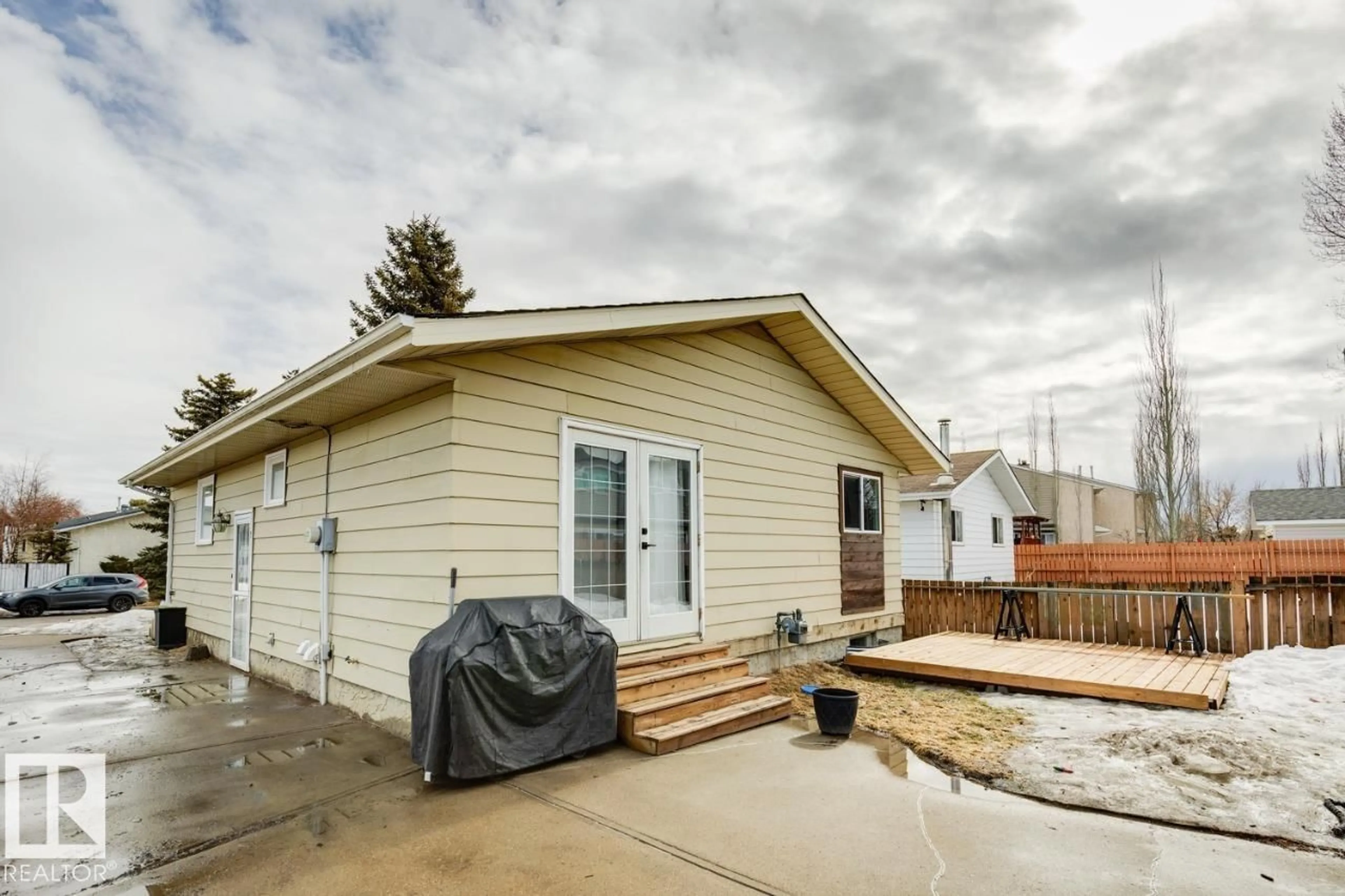 Home with vinyl exterior material, street for 14206 22A ST, Edmonton Alberta T5Y1E1