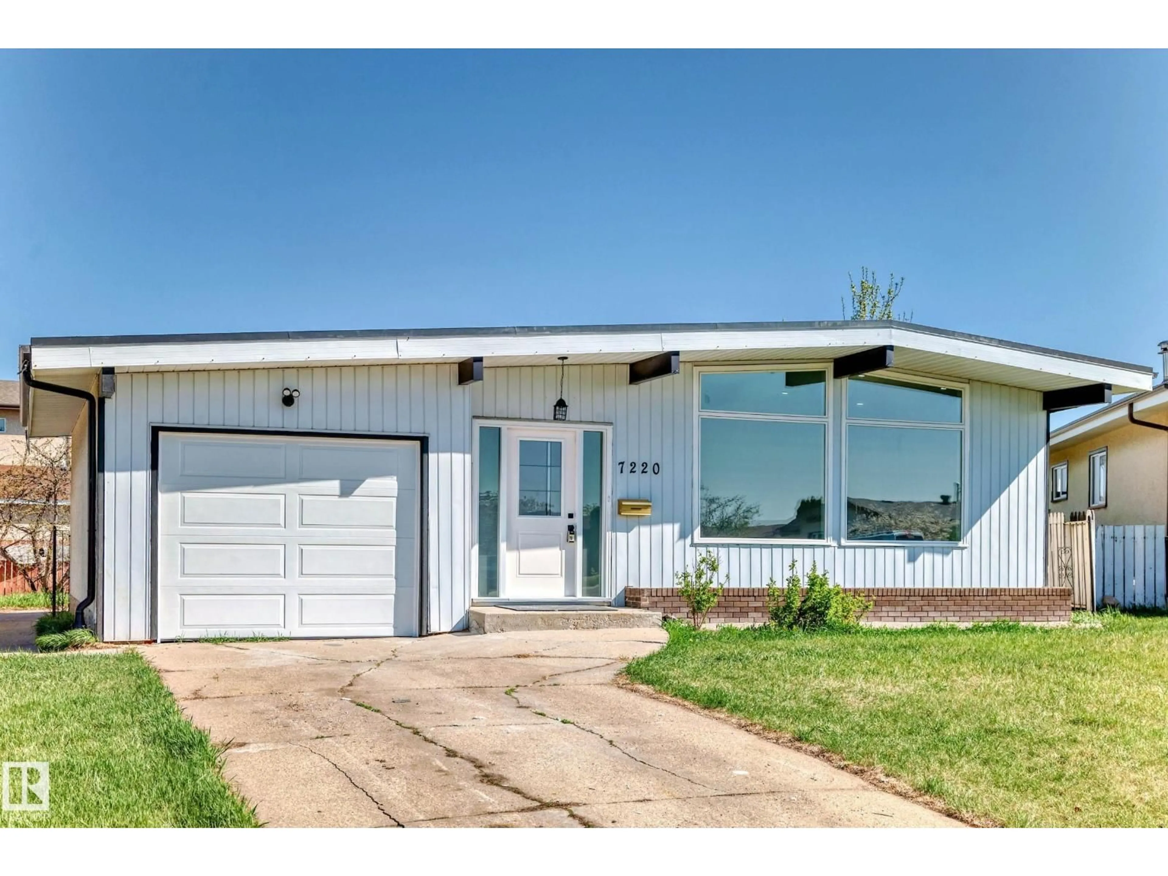 Home with vinyl exterior material, street for 7220 152A AVE, Edmonton Alberta T5C2Z4