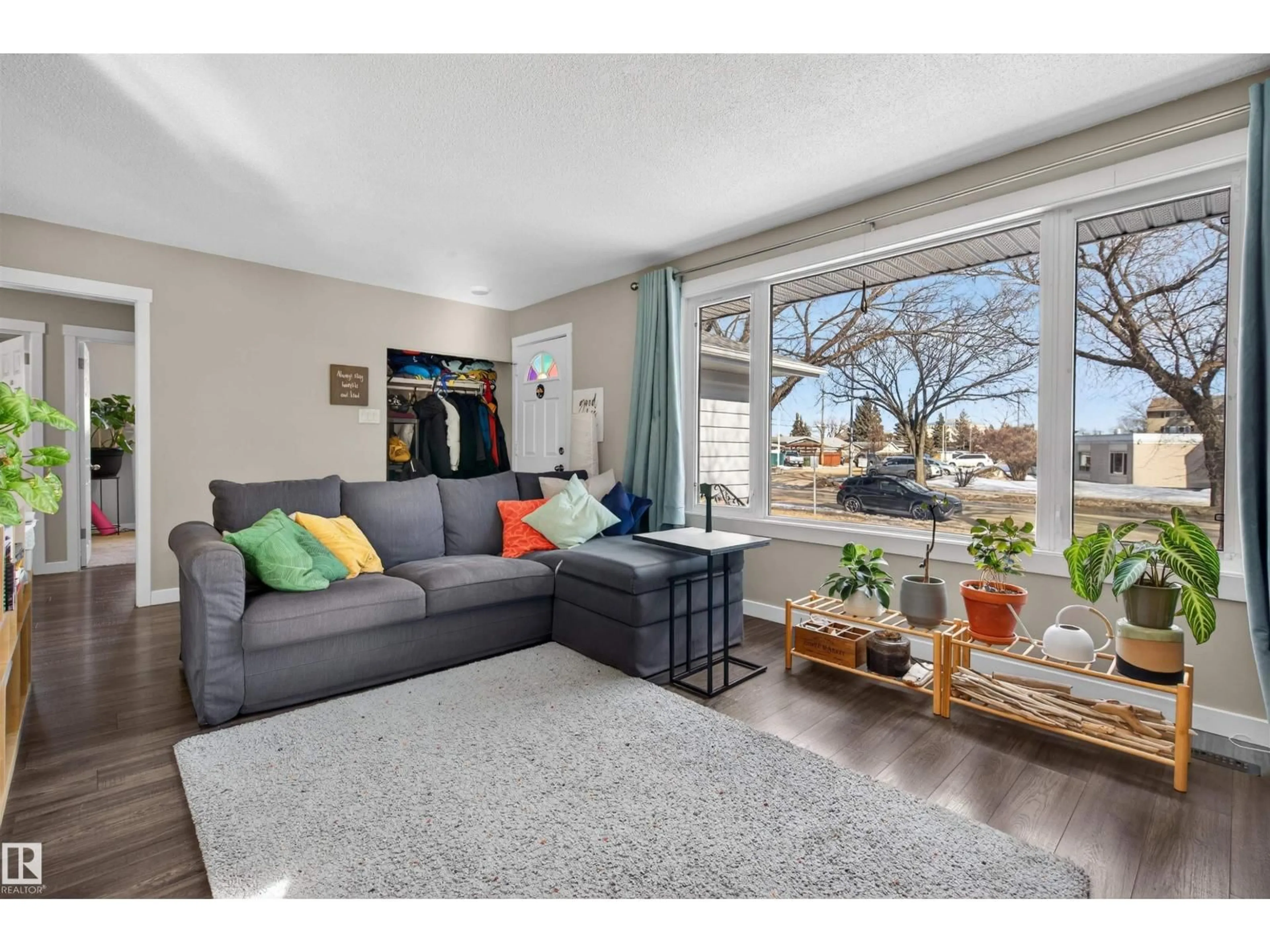 Living room with furniture, wood/laminate floor for 8906 168 ST NW, Edmonton Alberta T5R2V5