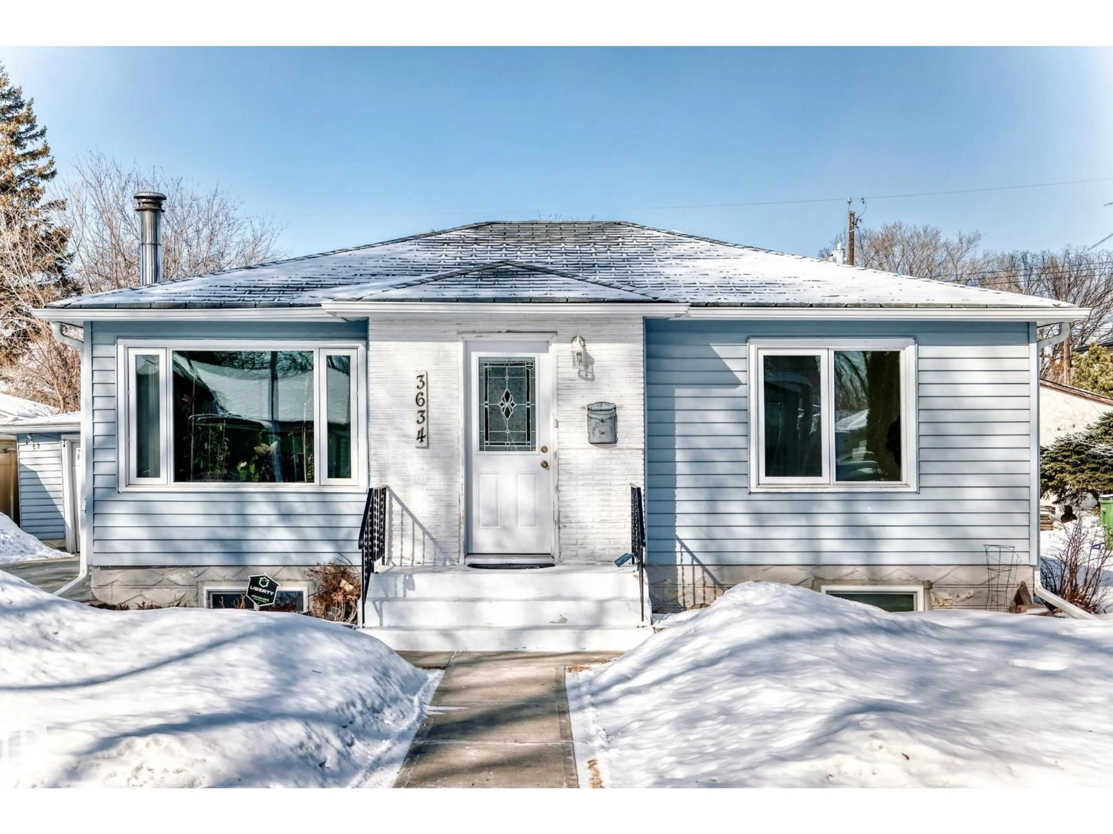 Home with vinyl exterior material, street for 3634 113 AV, Edmonton Alberta T5W0P8