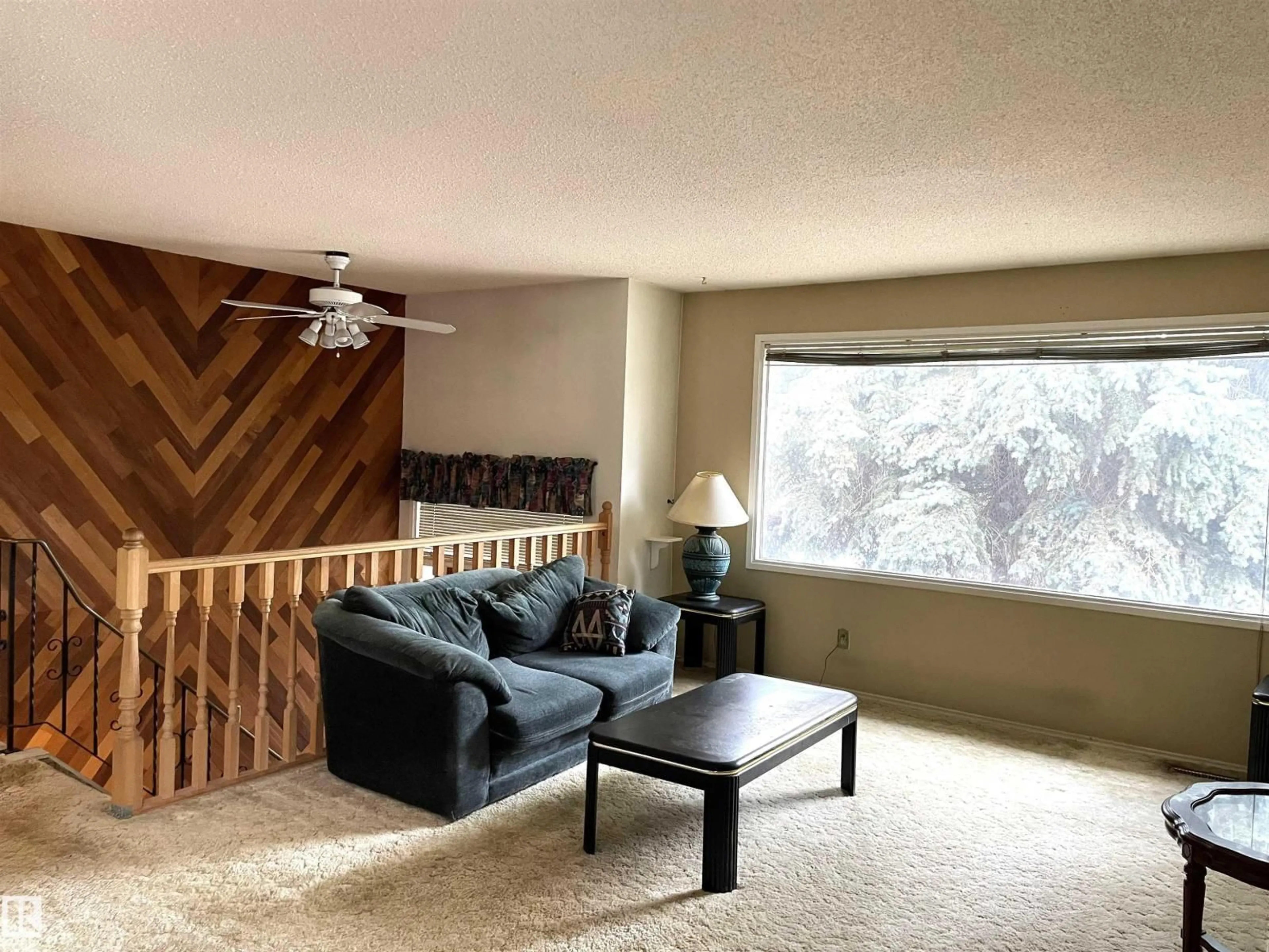 Living room with furniture, wood/laminate floor for 6808 11 AV, Edmonton Alberta T6K3J5