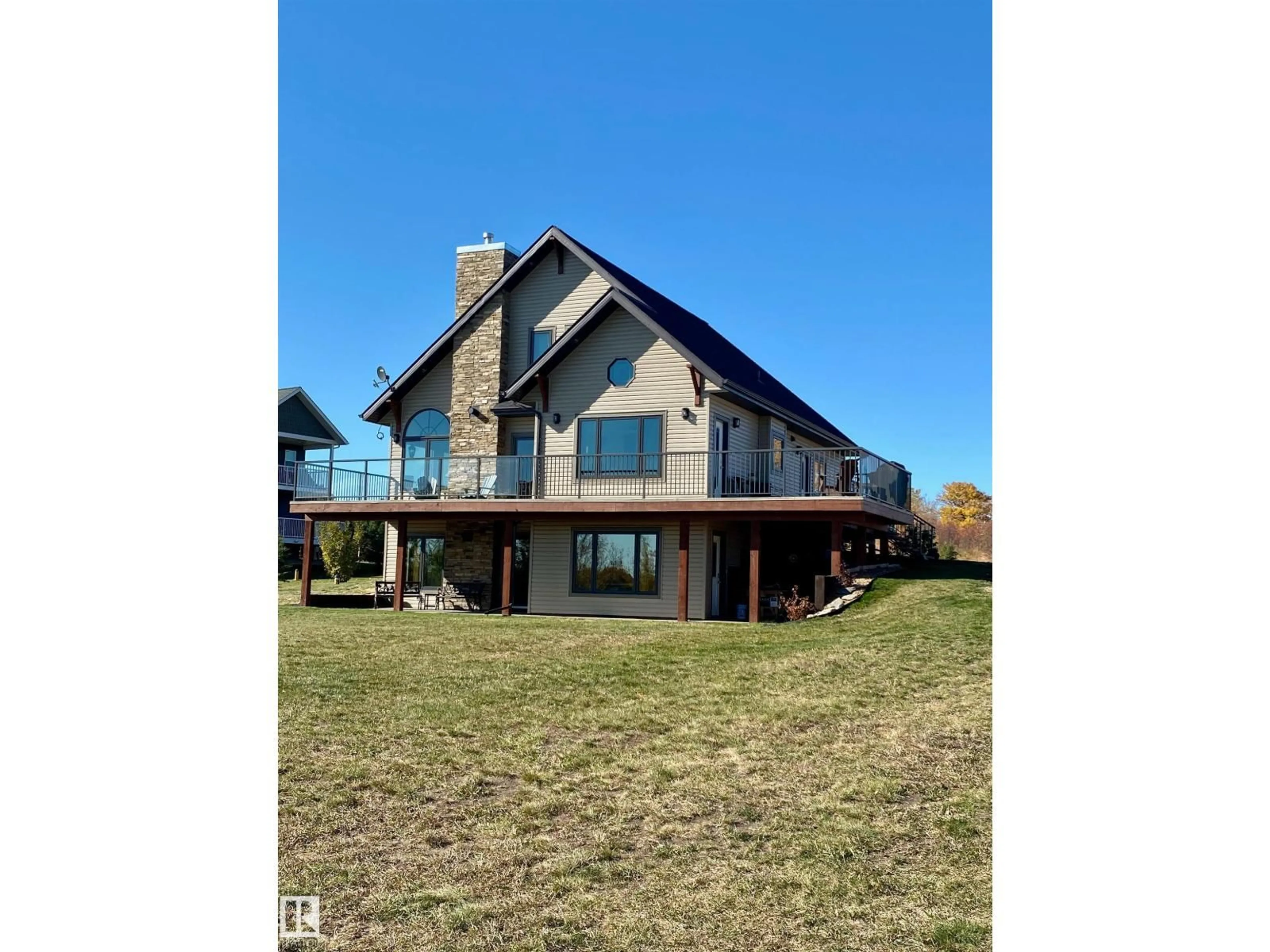 A pic from outside/outdoor area/front of a property/back of a property/a pic from drone, water/lake/river/ocean view for 34 - 562115 RR 114, Rural Two Hills County Alberta T0B4K0