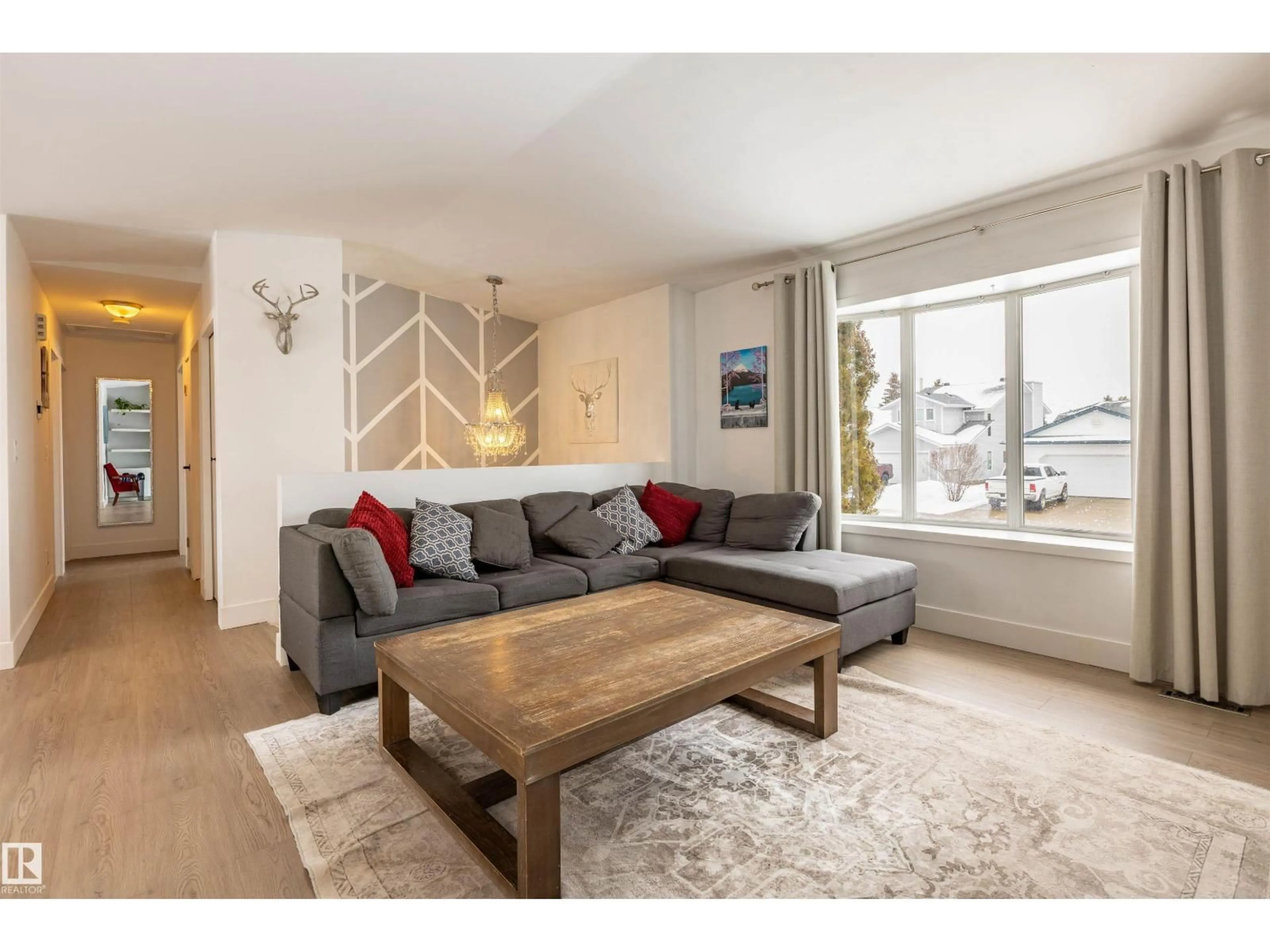 Living room with furniture, wood/laminate floor for 5210 52A ST, Legal Alberta T0G1L0