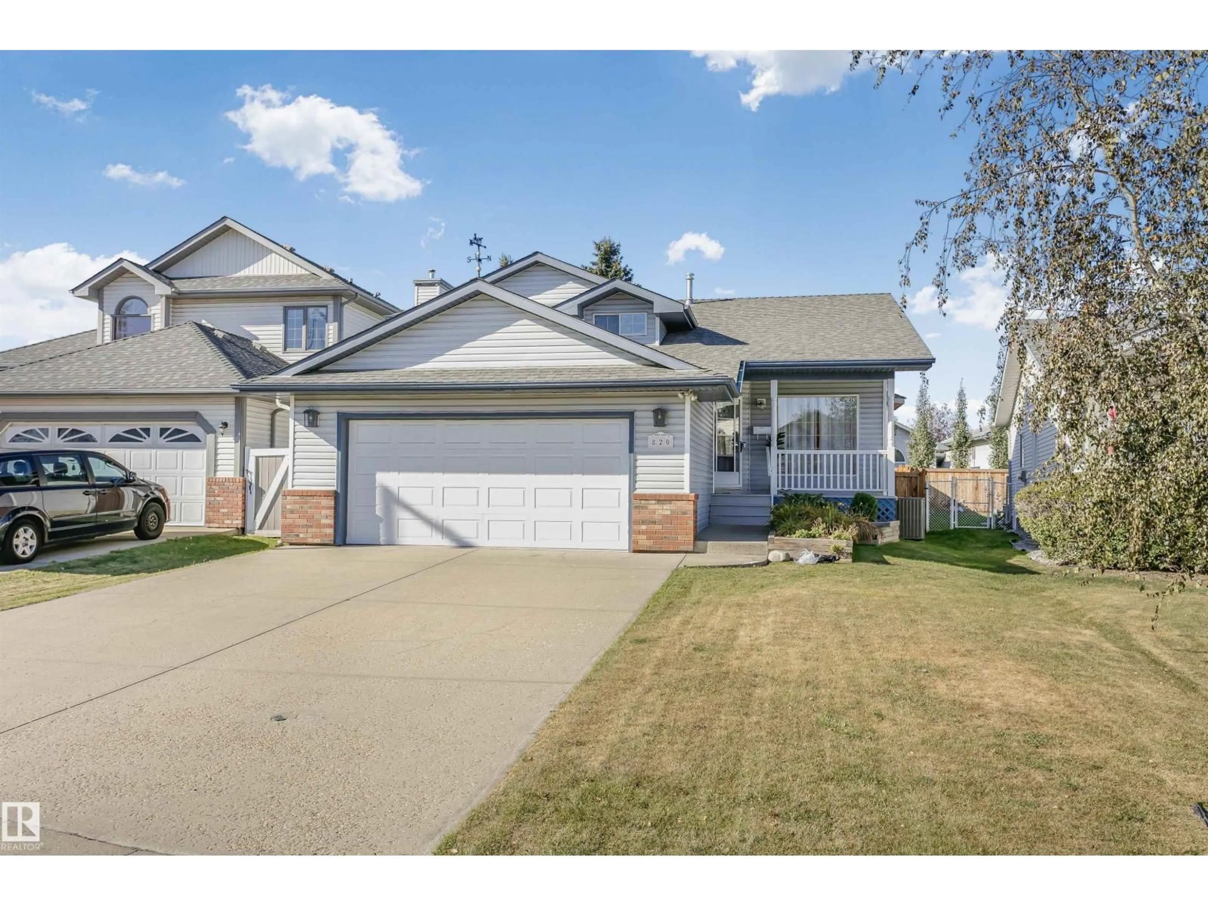 Home with vinyl exterior material, street for NW - 820 115A ST, Edmonton Alberta T6J6T9