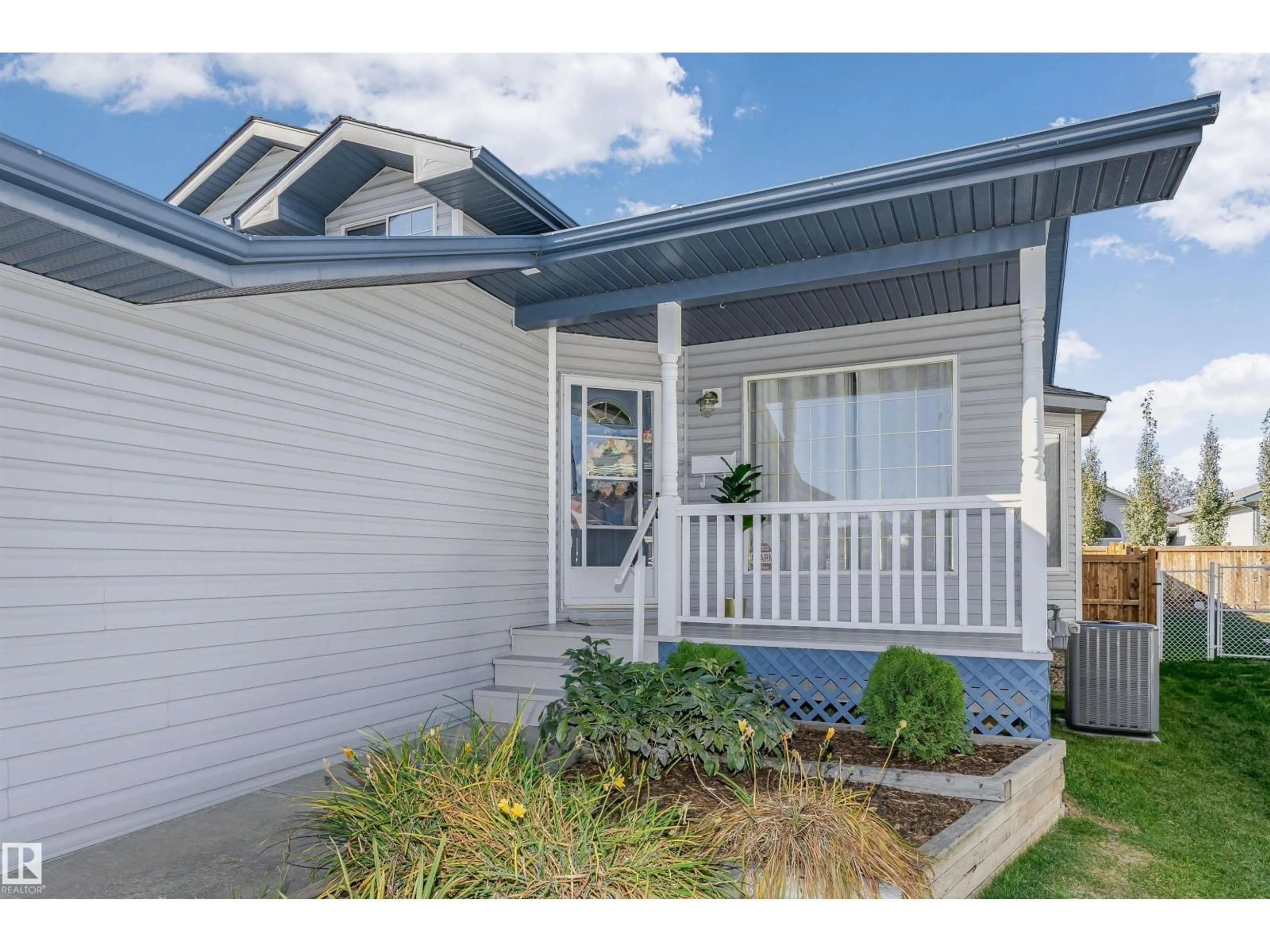 Home with vinyl exterior material, street for NW - 820 115A ST, Edmonton Alberta T6J6T9