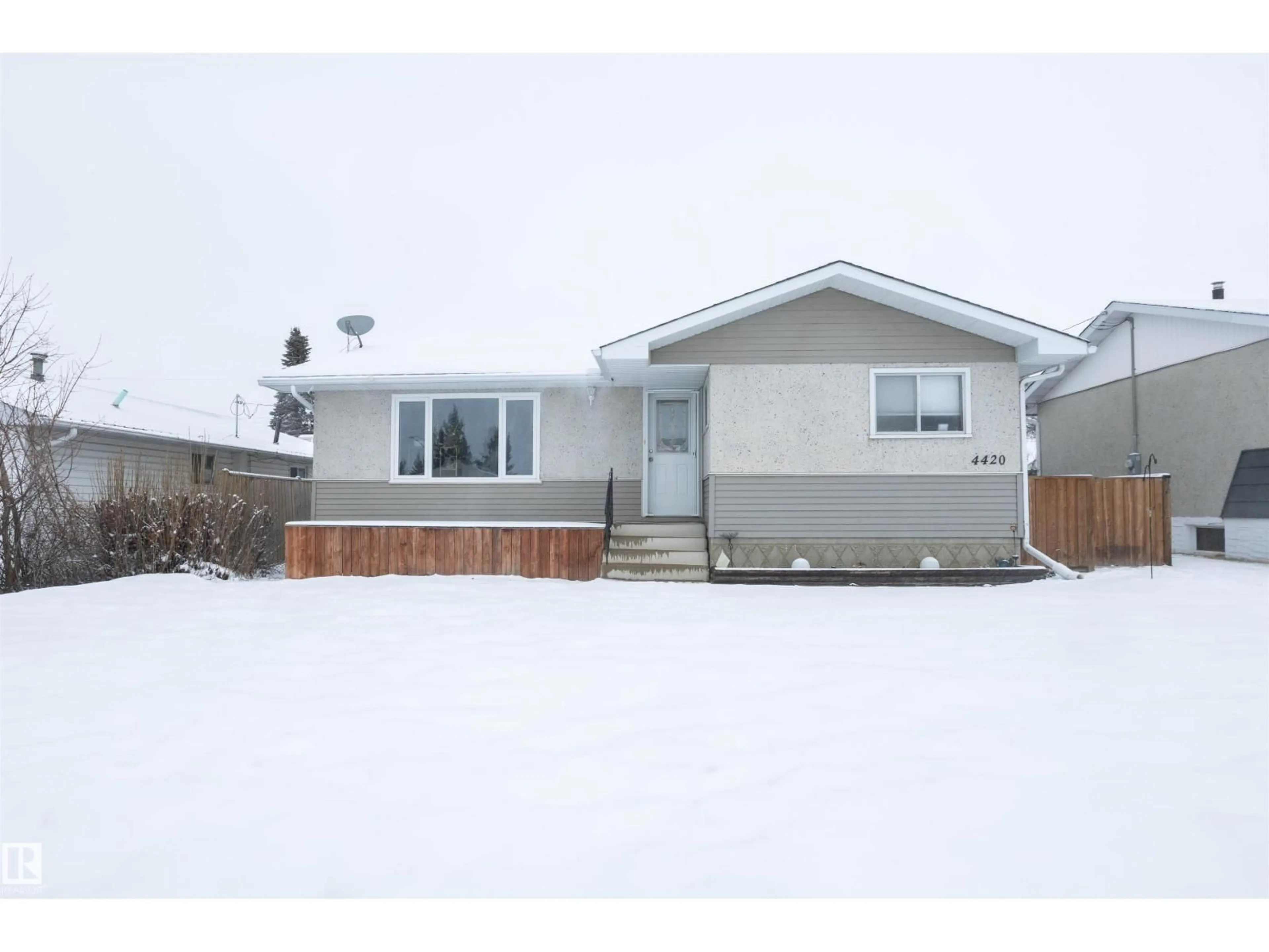Home with vinyl exterior material, street for 4420 56 AV, Barrhead Alberta T7N1K6