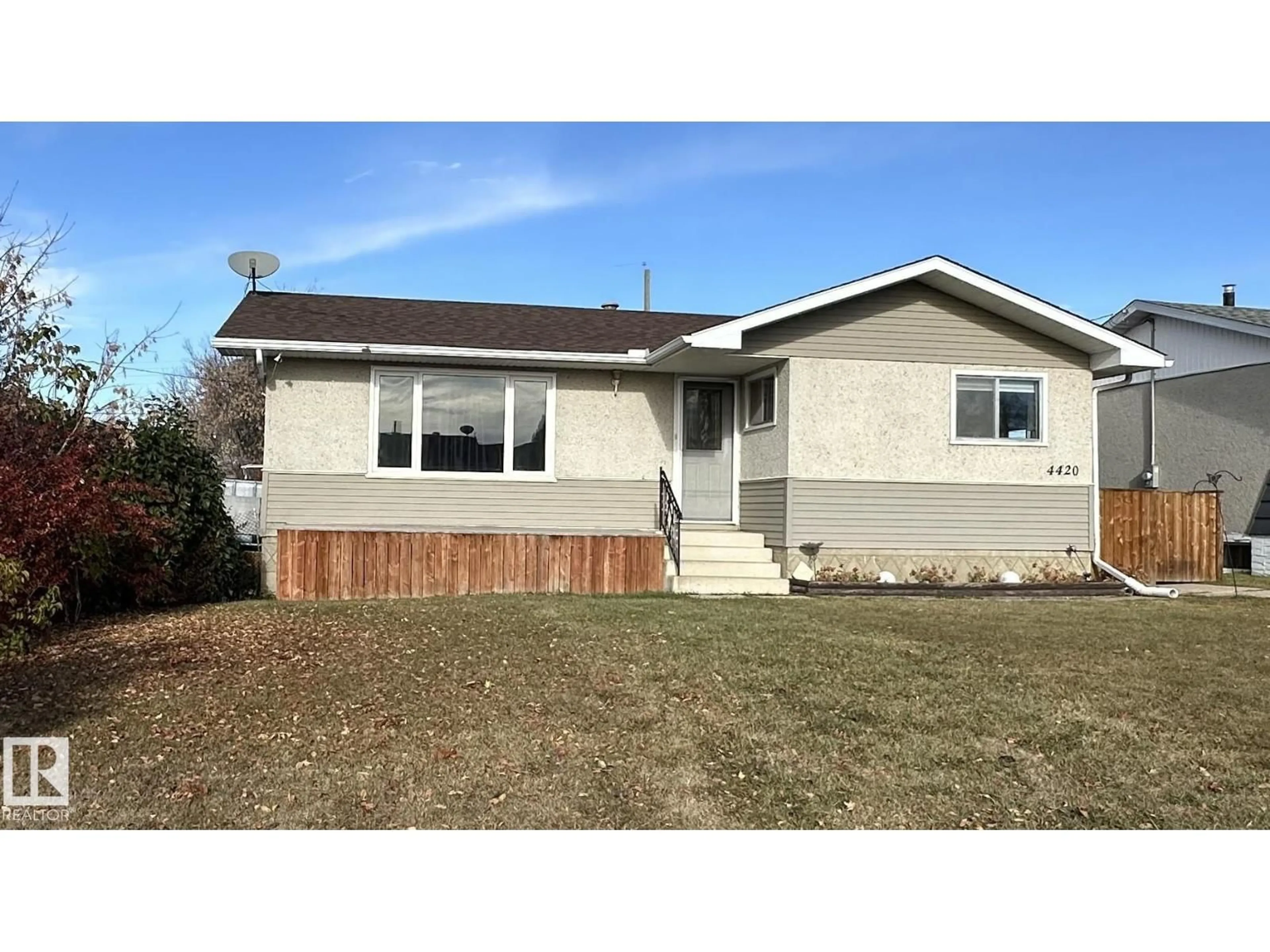 Home with vinyl exterior material, street for 4420 56 AV, Barrhead Alberta T7N1K6