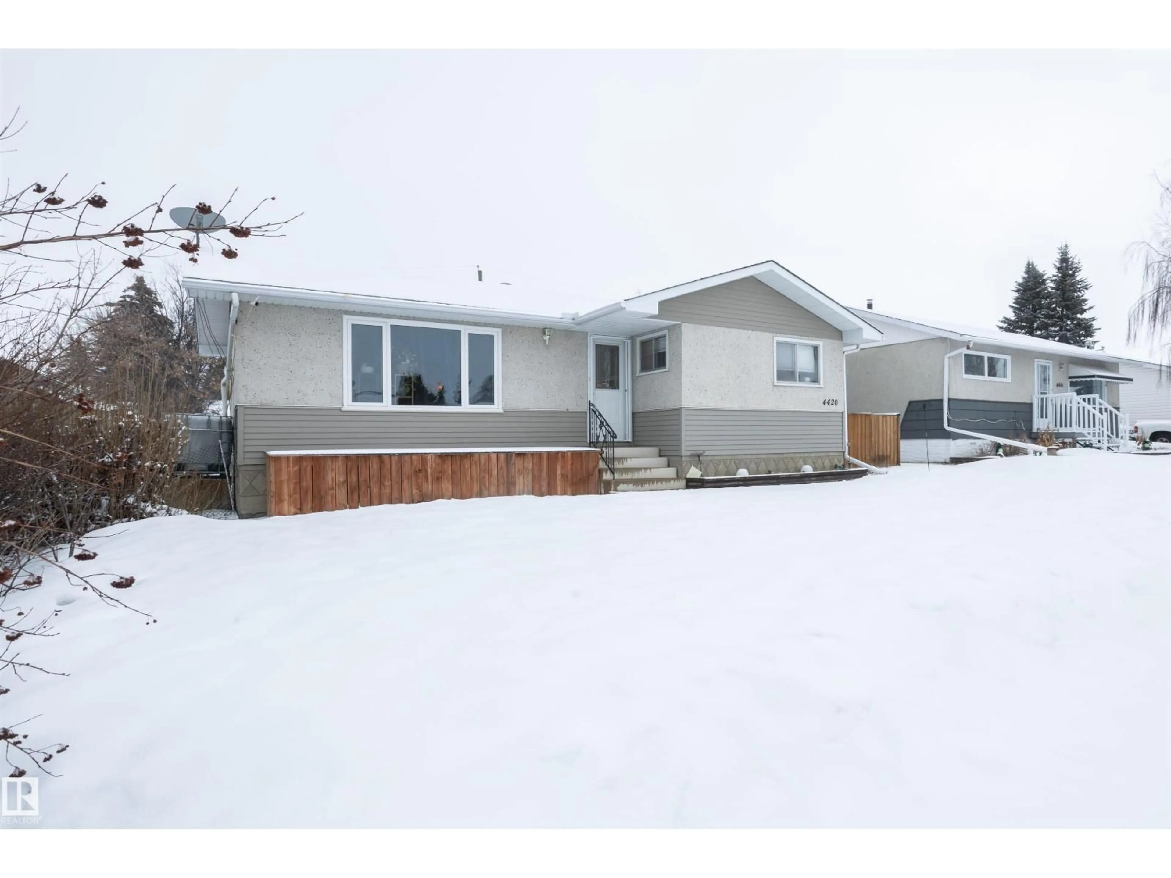Home with vinyl exterior material, street for 4420 56 AV, Barrhead Alberta T7N1K6
