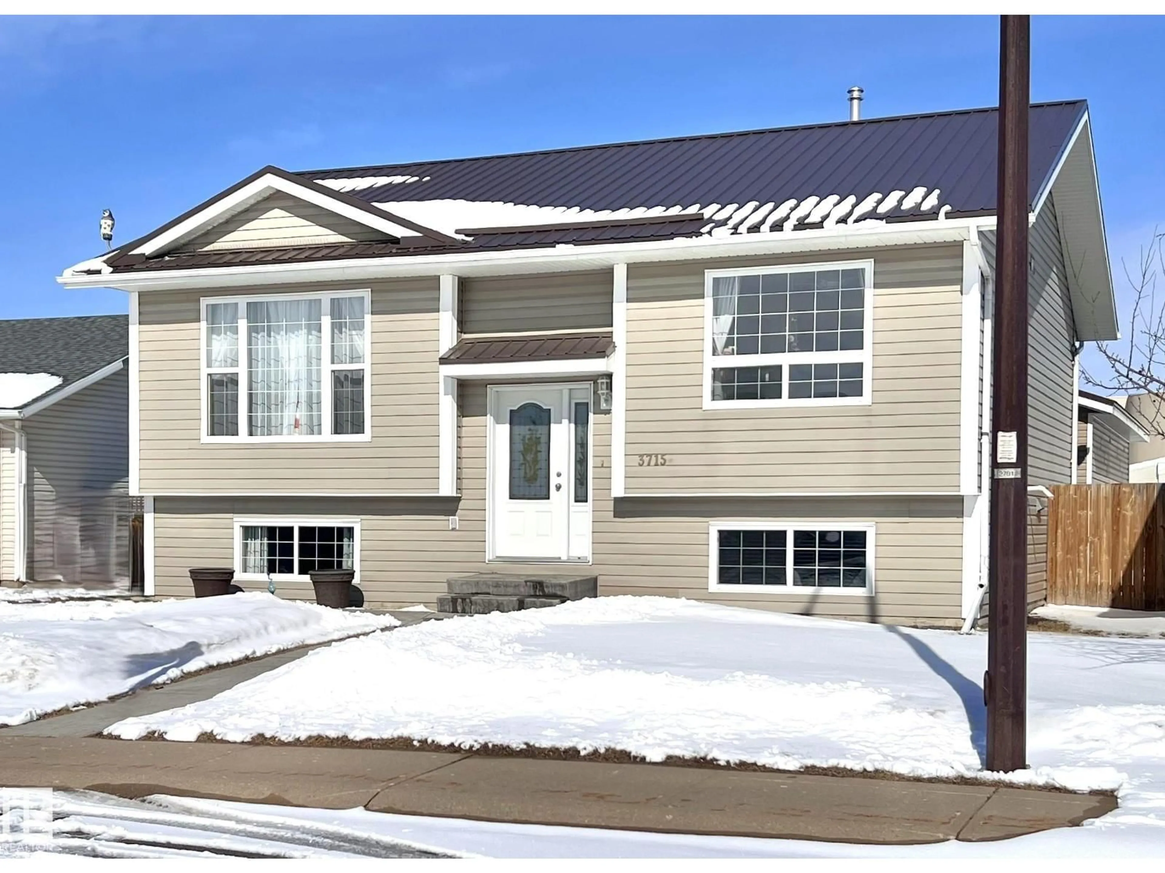 Home with vinyl exterior material, street for 3715 42 AV, Bonnyville Town Alberta T9N2J8