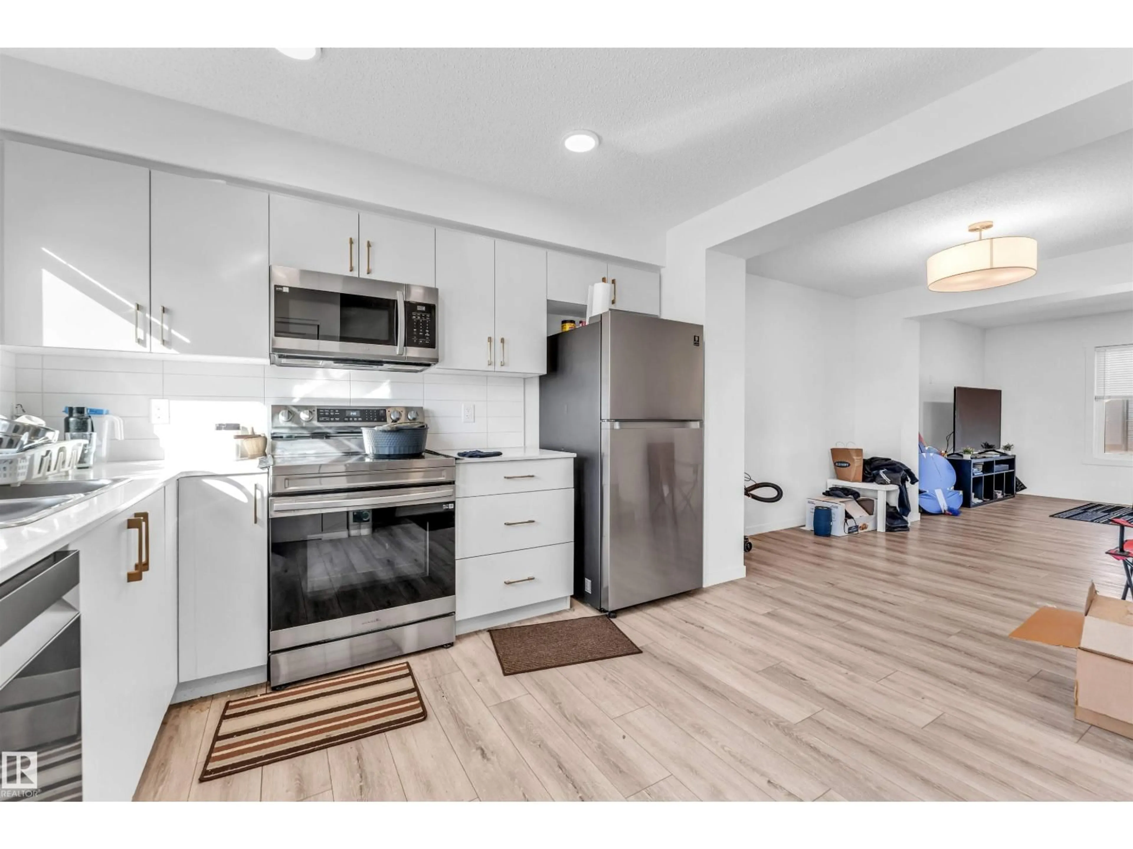 Open concept kitchen, wood/laminate floor for 1106 ASTER BV, Edmonton Alberta T6T2V2