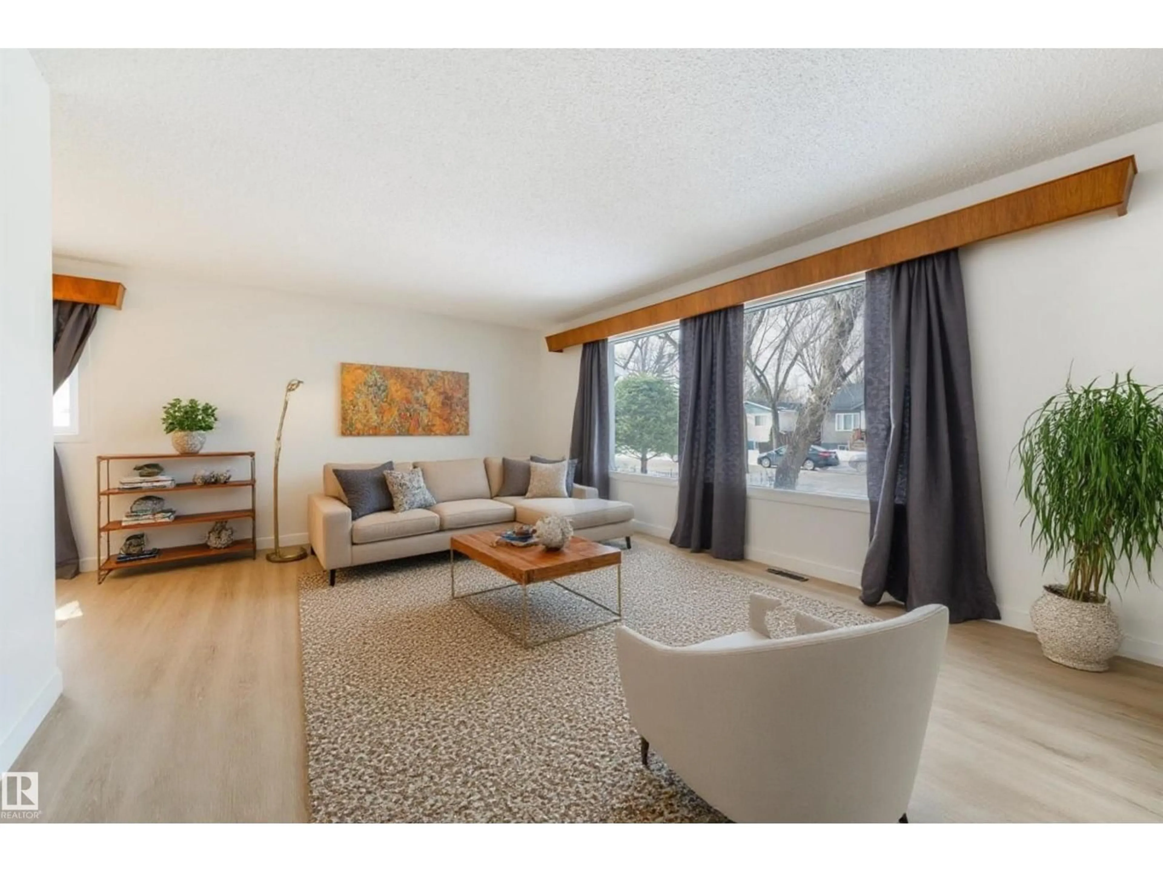 Living room with furniture, wood/laminate floor for NW - 9613 151 ST, Edmonton Alberta T5P1S5