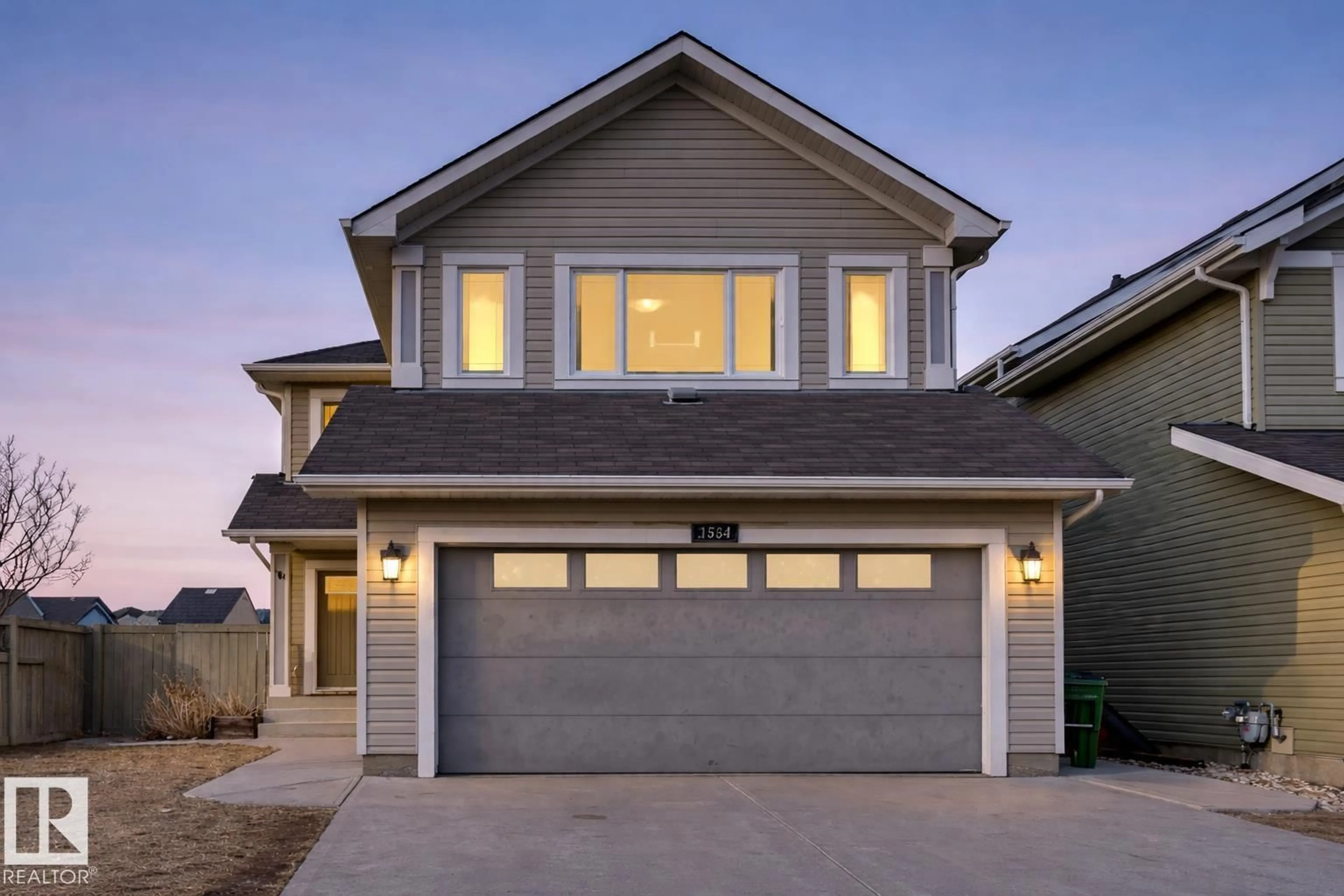 Home with vinyl exterior material, street for 1564 36 AV, Edmonton Alberta T5P0L9