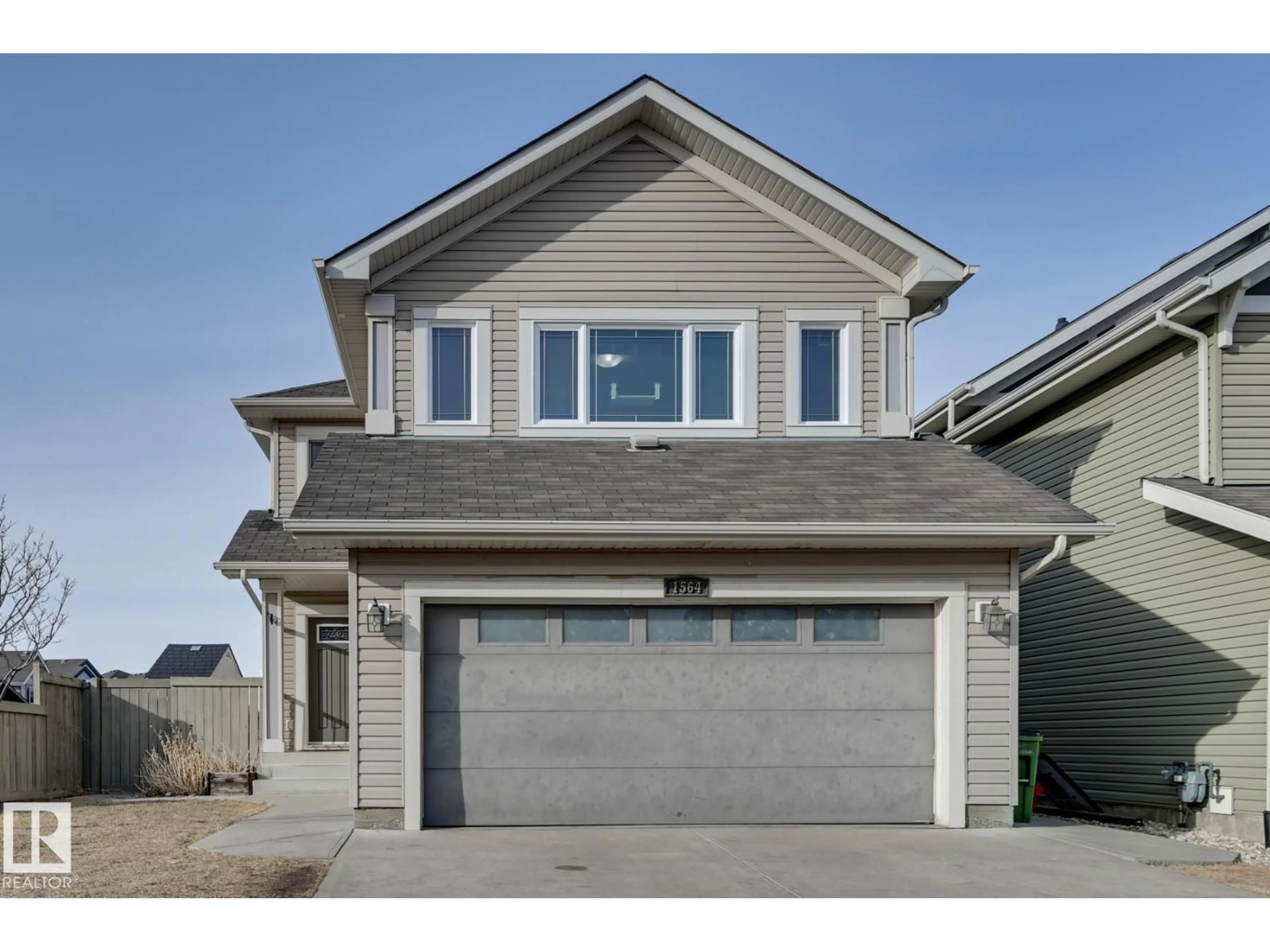 Home with vinyl exterior material, street for 1564 36 AV, Edmonton Alberta T5P0L9
