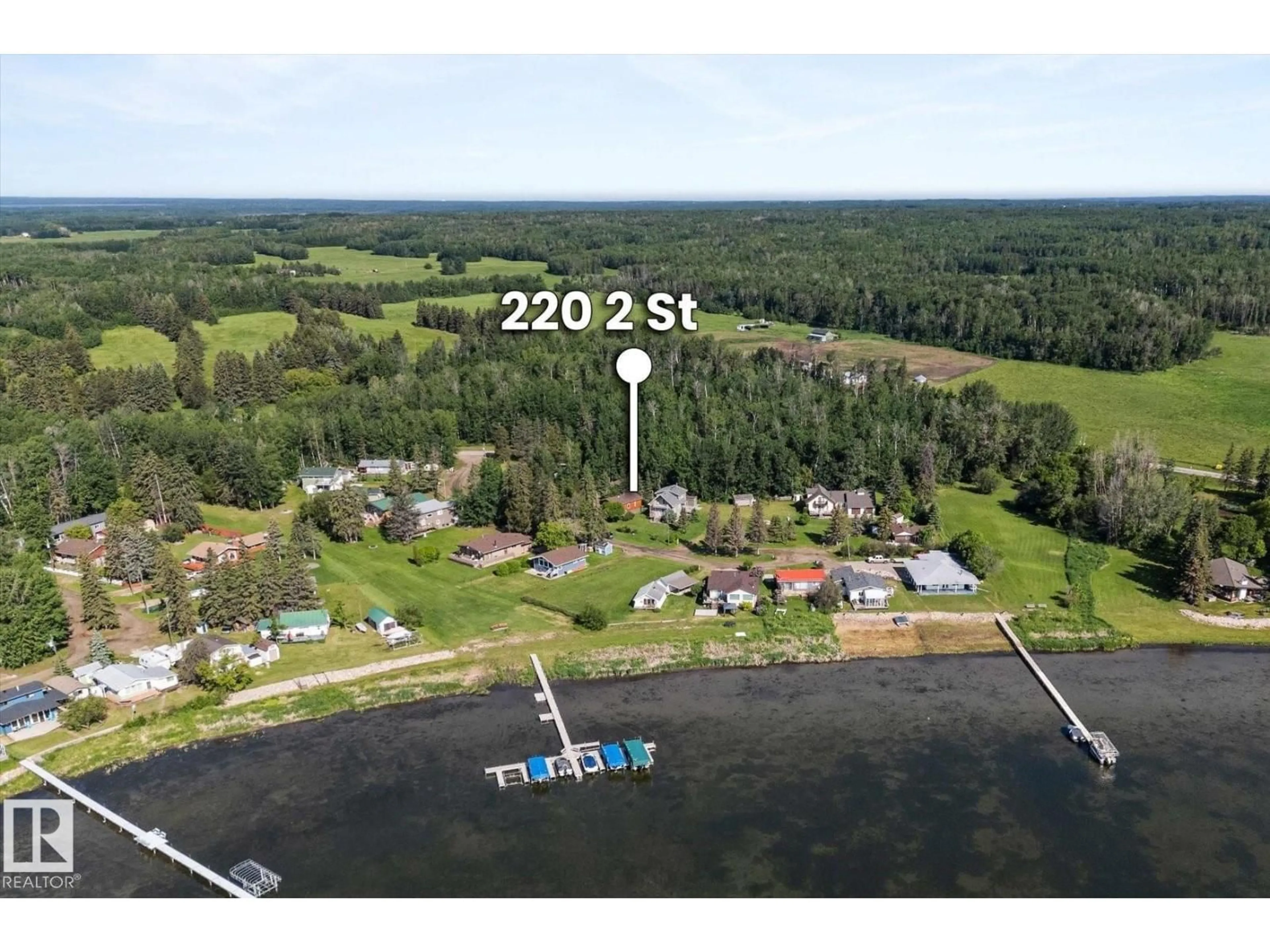 A pic from outside/outdoor area/front of a property/back of a property/a pic from drone, water/lake/river/ocean view for 220 2 ST, Rural Lac Ste. Anne County Alberta T0E1A0