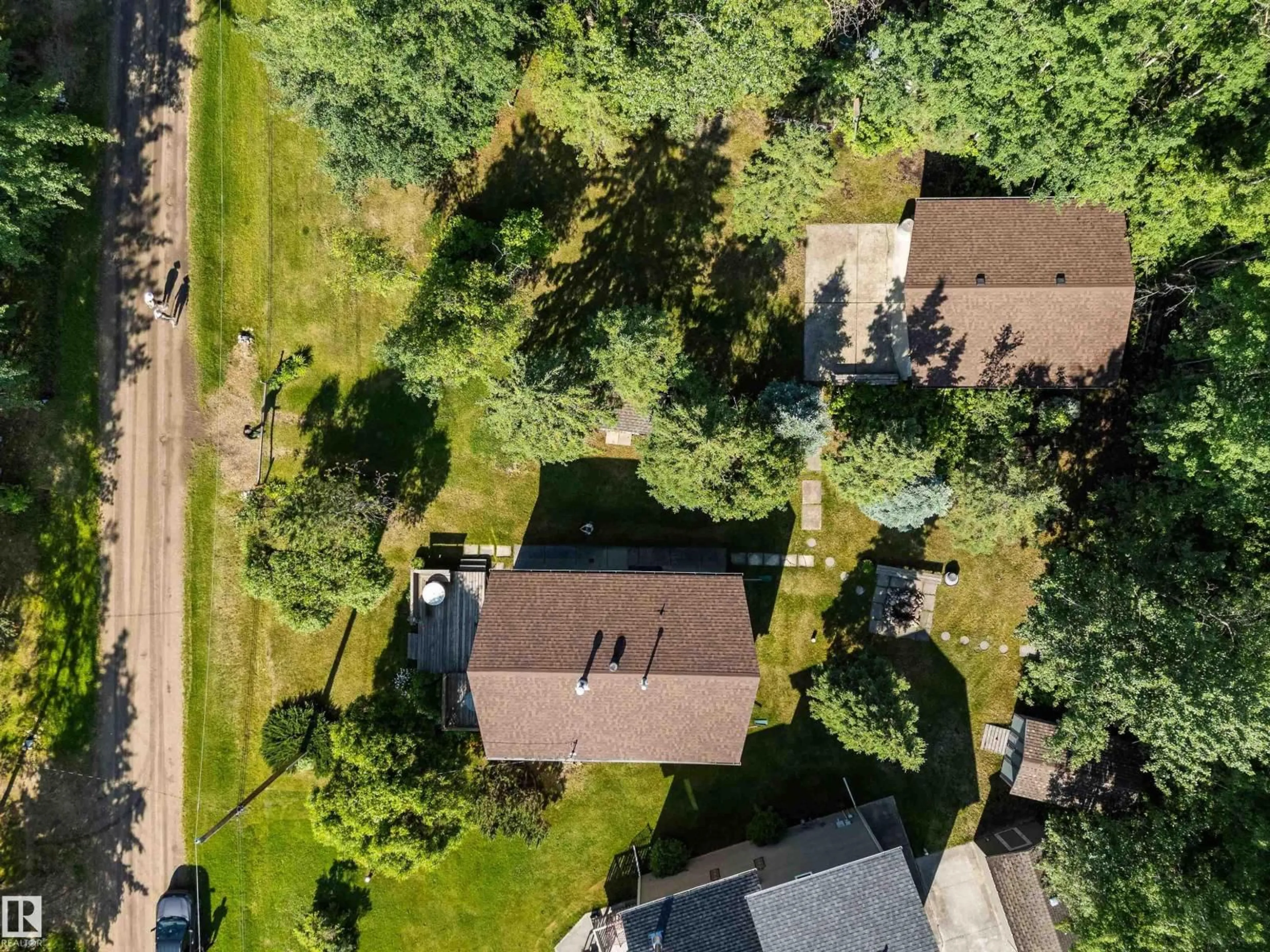 A pic from outside/outdoor area/front of a property/back of a property/a pic from drone, street for 220 2 ST, Rural Lac Ste. Anne County Alberta T0E1A0