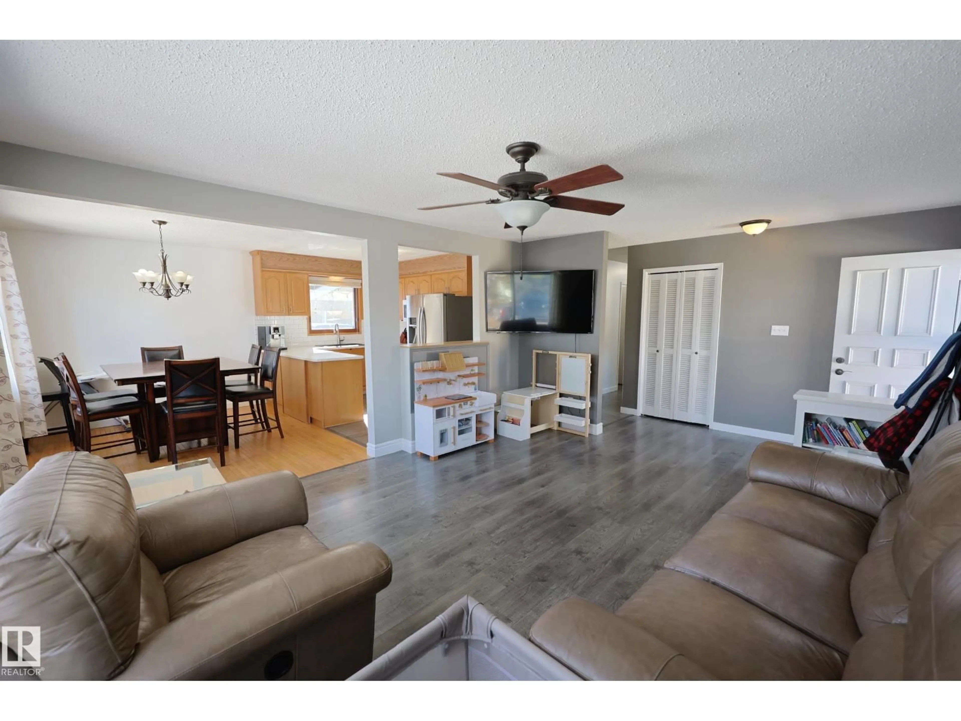 Living room with furniture, wood/laminate floor for 37 ARMSTRONG CR, Leduc Alberta T9E5G1