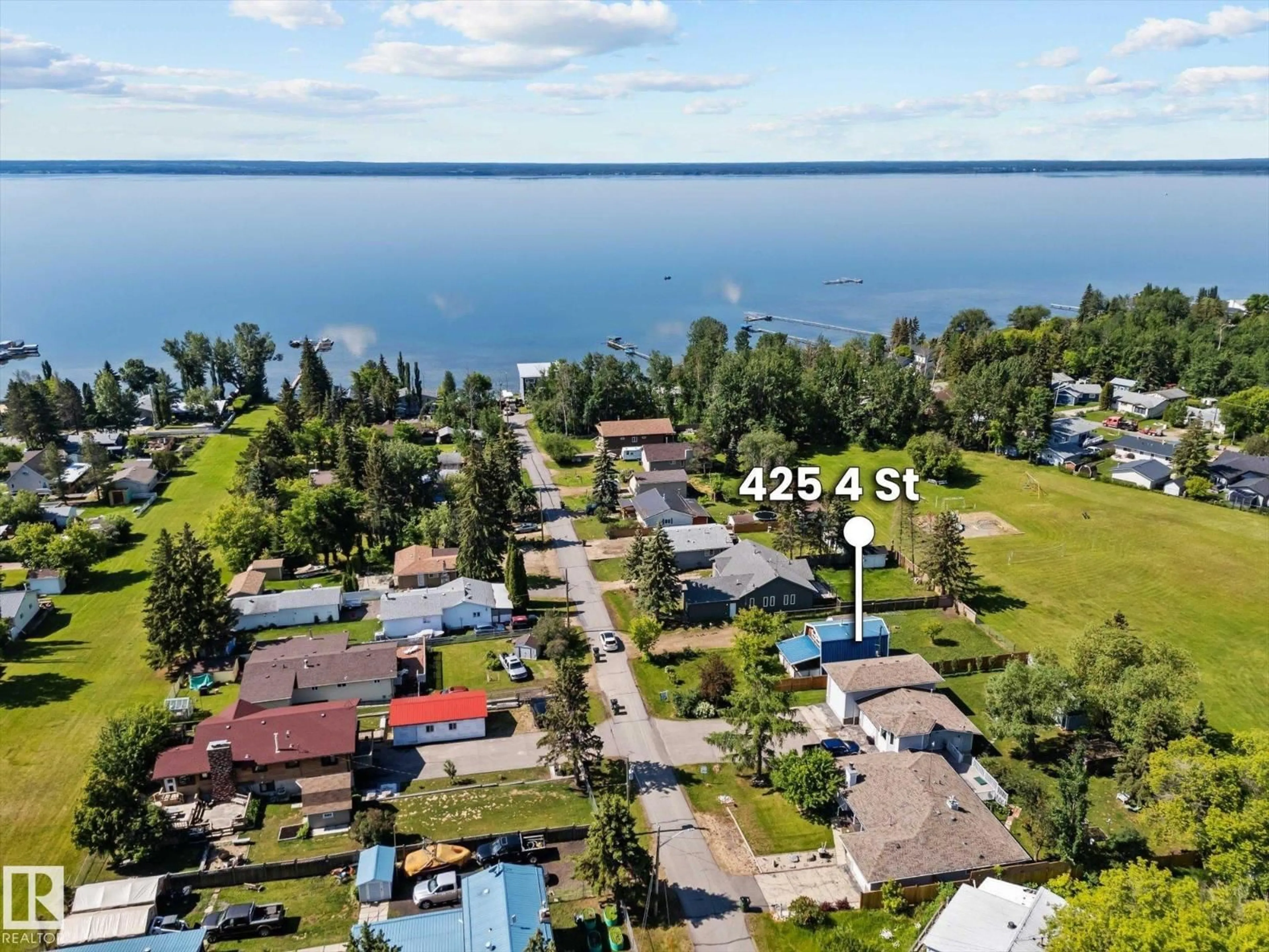 A pic from outside/outdoor area/front of a property/back of a property/a pic from drone, water/lake/river/ocean view for 425 4 ST, Rural Lac Ste. Anne County Alberta T0E0A0
