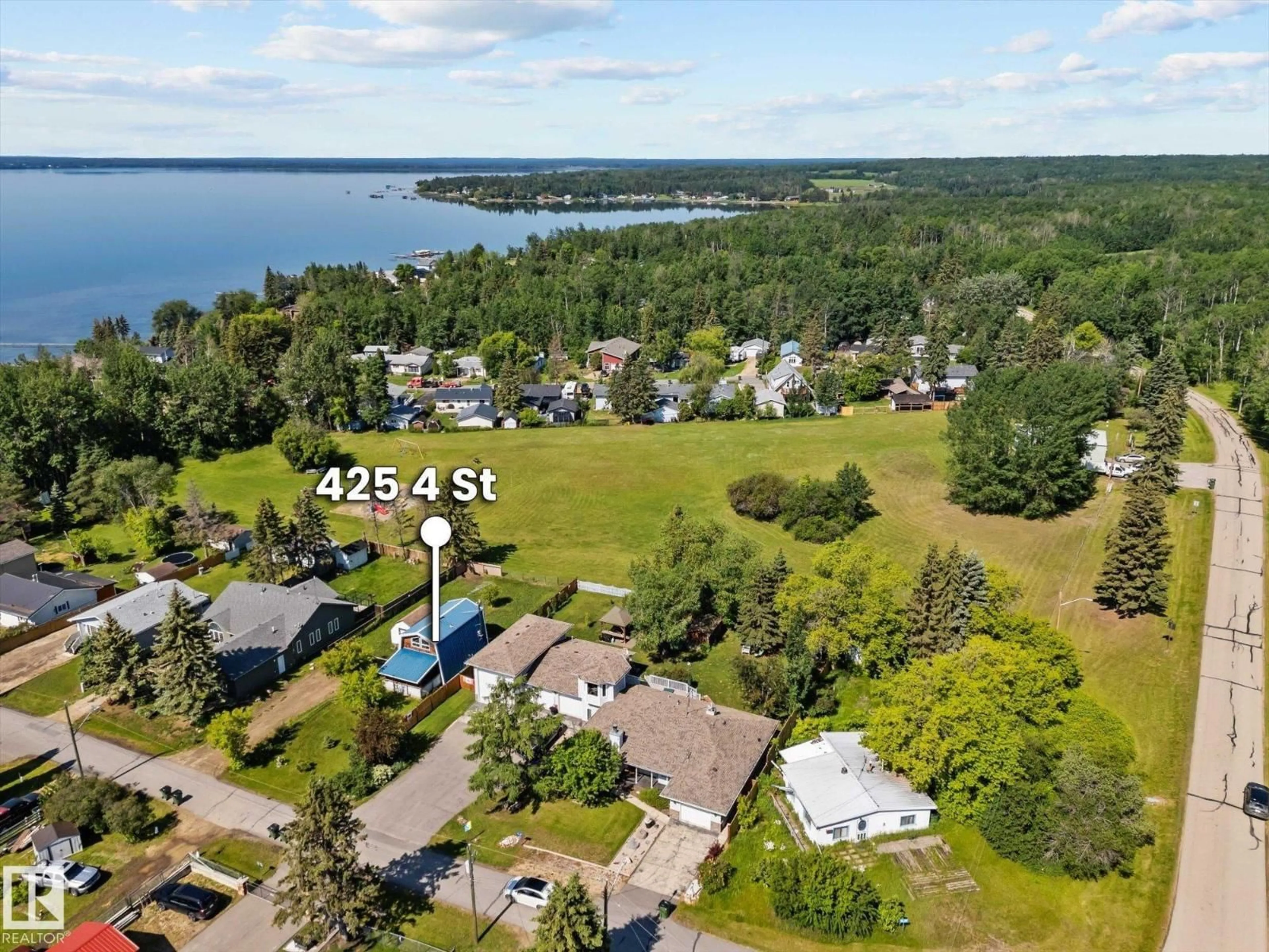 A pic from outside/outdoor area/front of a property/back of a property/a pic from drone, water/lake/river/ocean view for 425 4 ST, Rural Lac Ste. Anne County Alberta T0E0A0