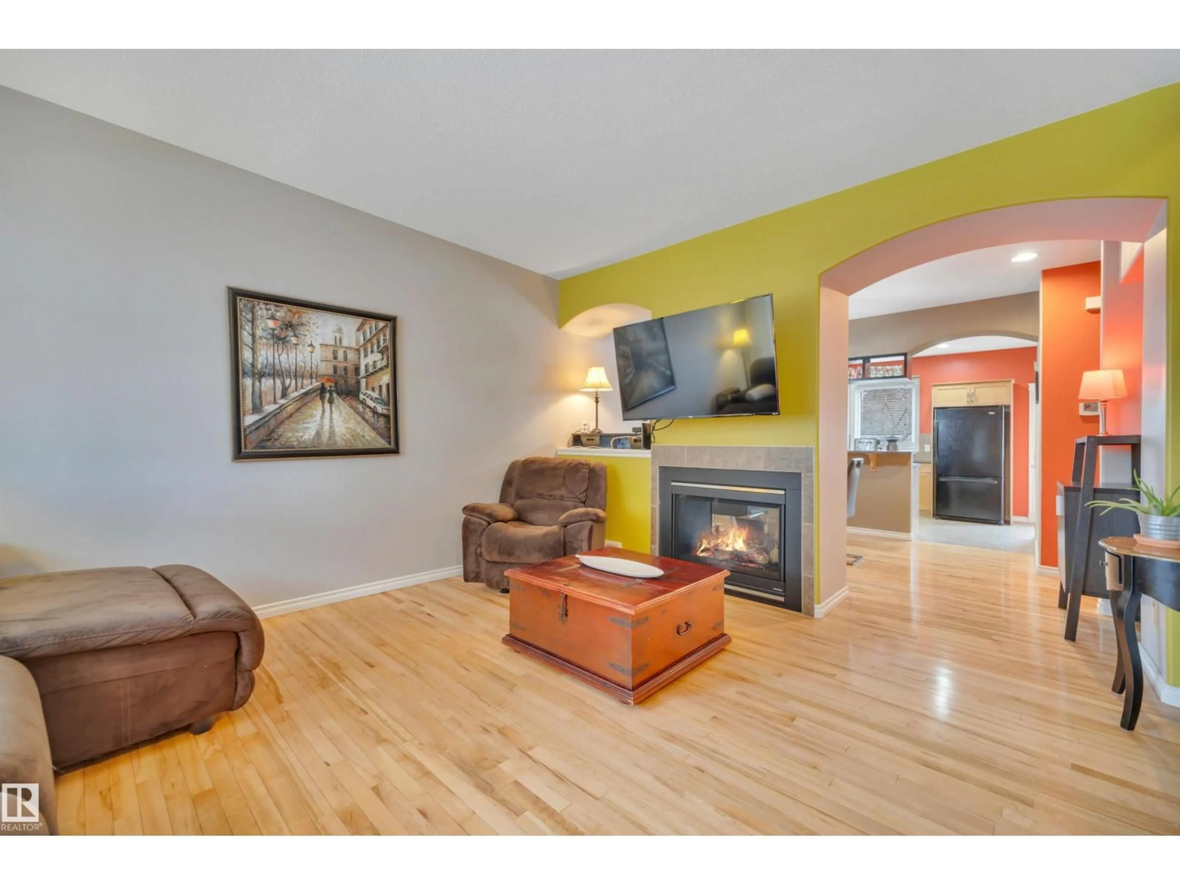 Living room with furniture, wood/laminate floor for 9555 73 AV, Edmonton Alberta T6E1B1