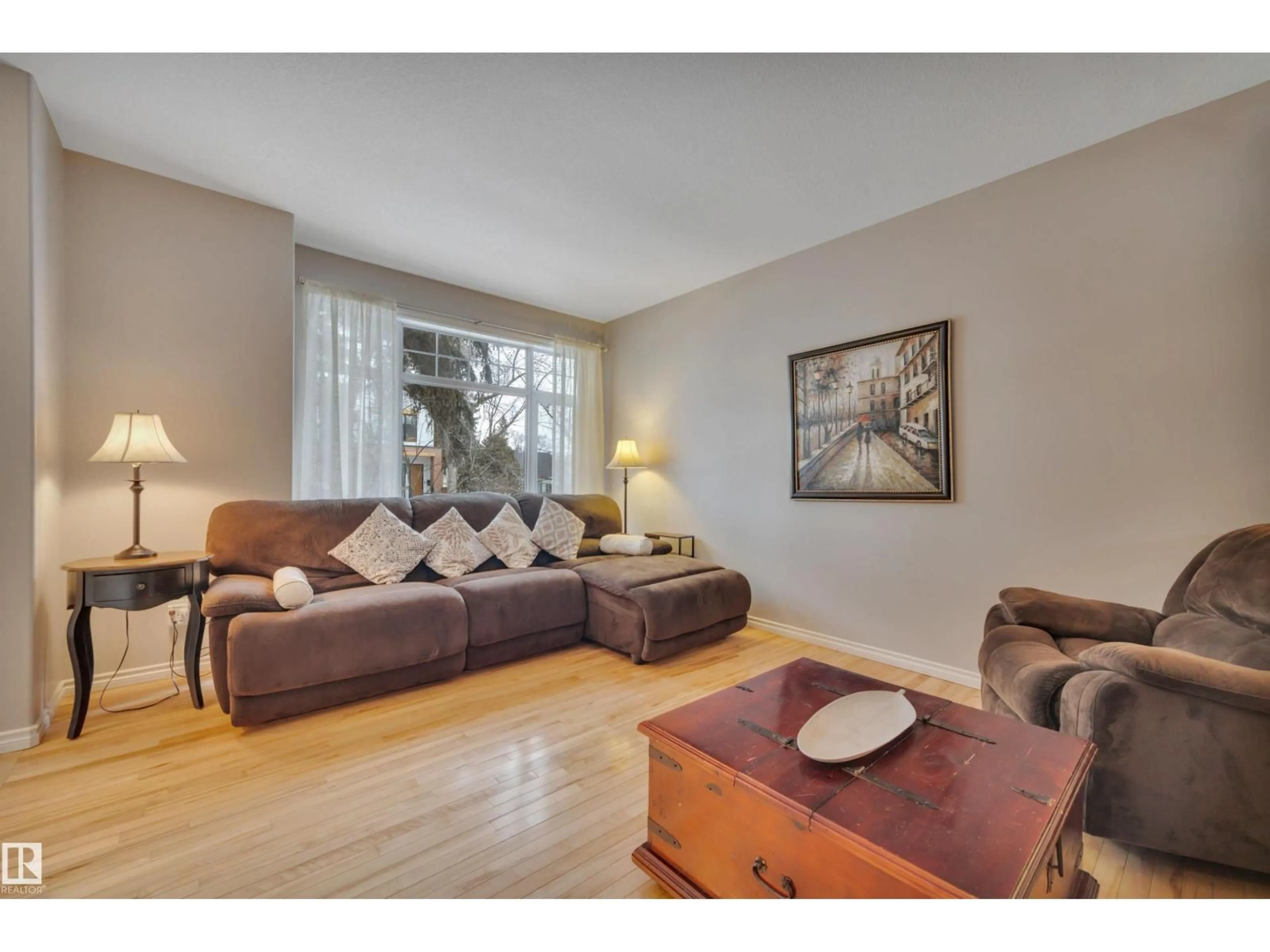 Living room with furniture, wood/laminate floor for 9555 73 AV, Edmonton Alberta T6E1B1