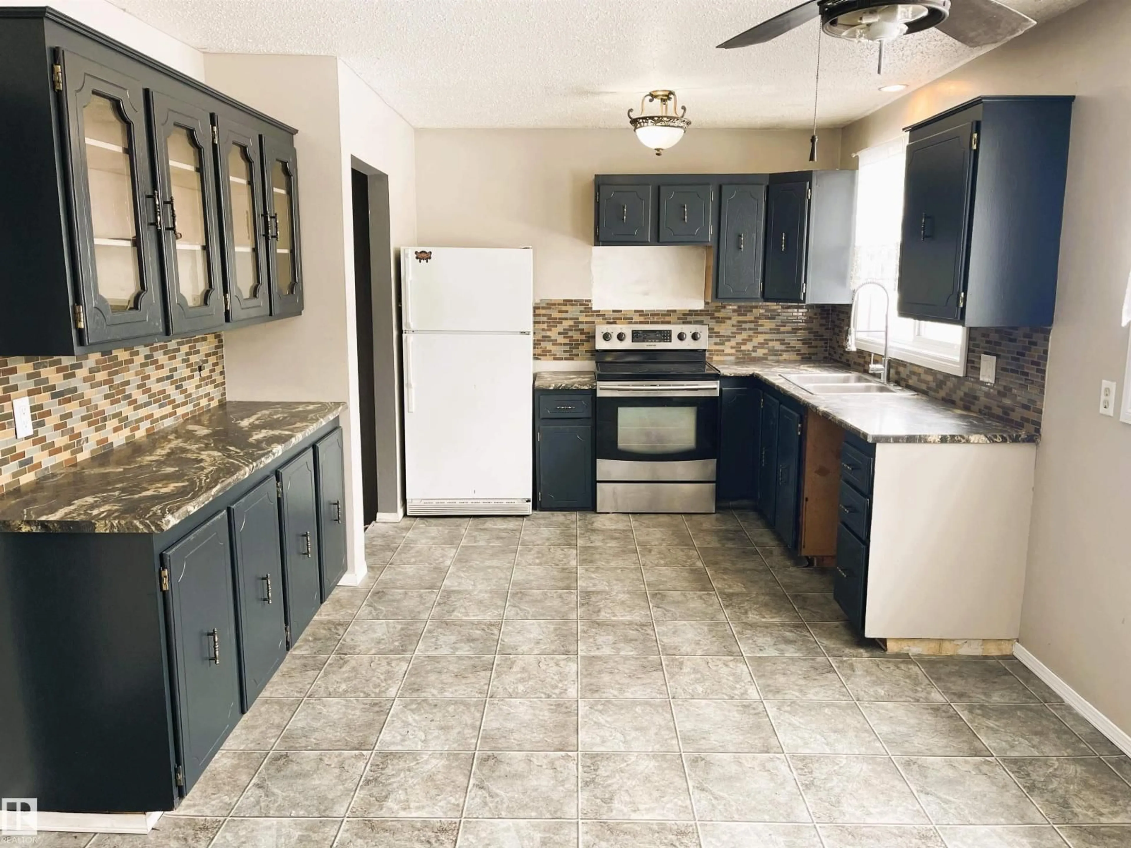 Standard kitchen, ceramic/tile floor for 5312 51 AVENUE, Bonnyville Town Alberta T9N2A4