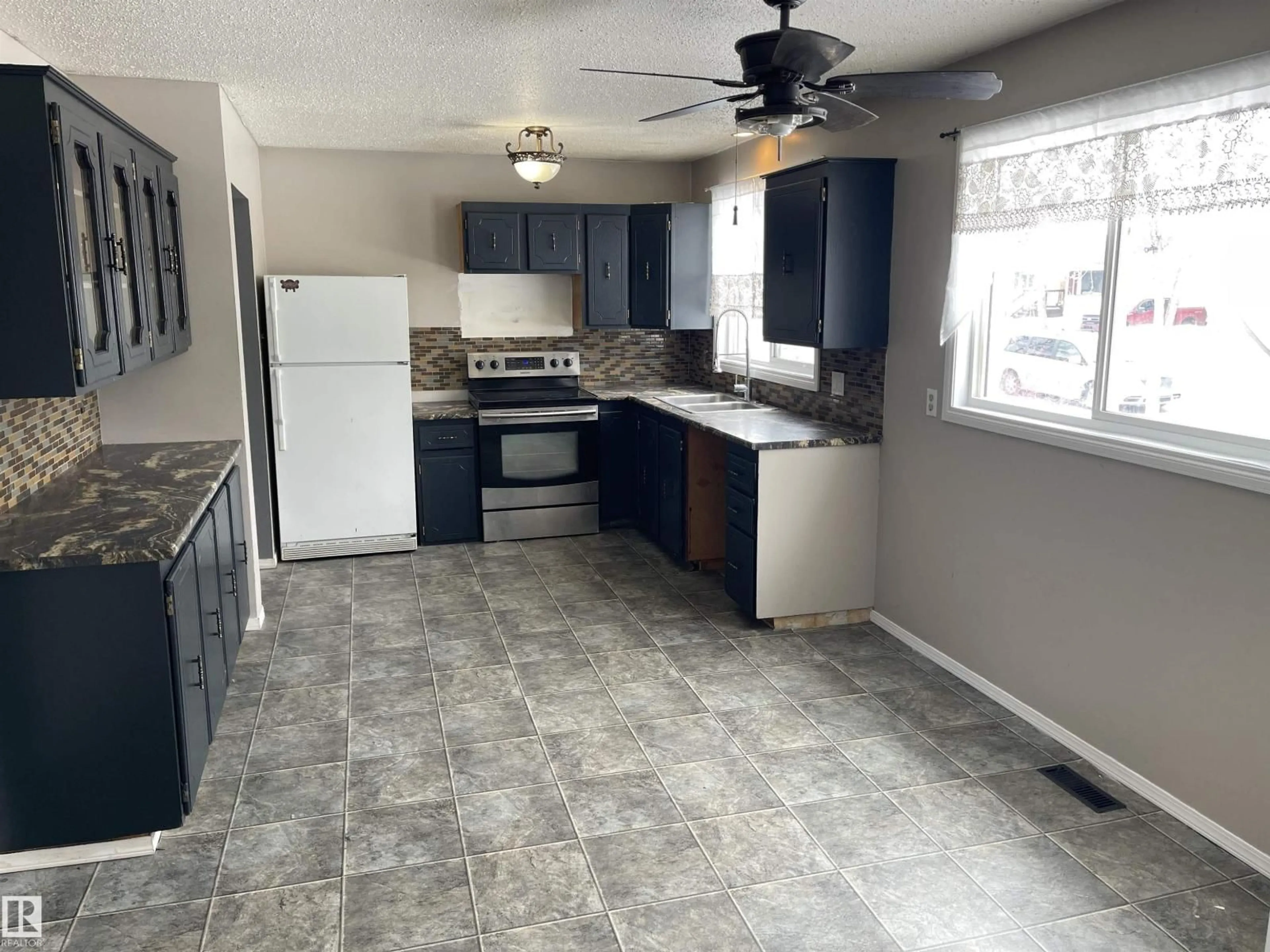 Standard kitchen, ceramic/tile floor for 5312 51 AVENUE, Bonnyville Town Alberta T9N2A4