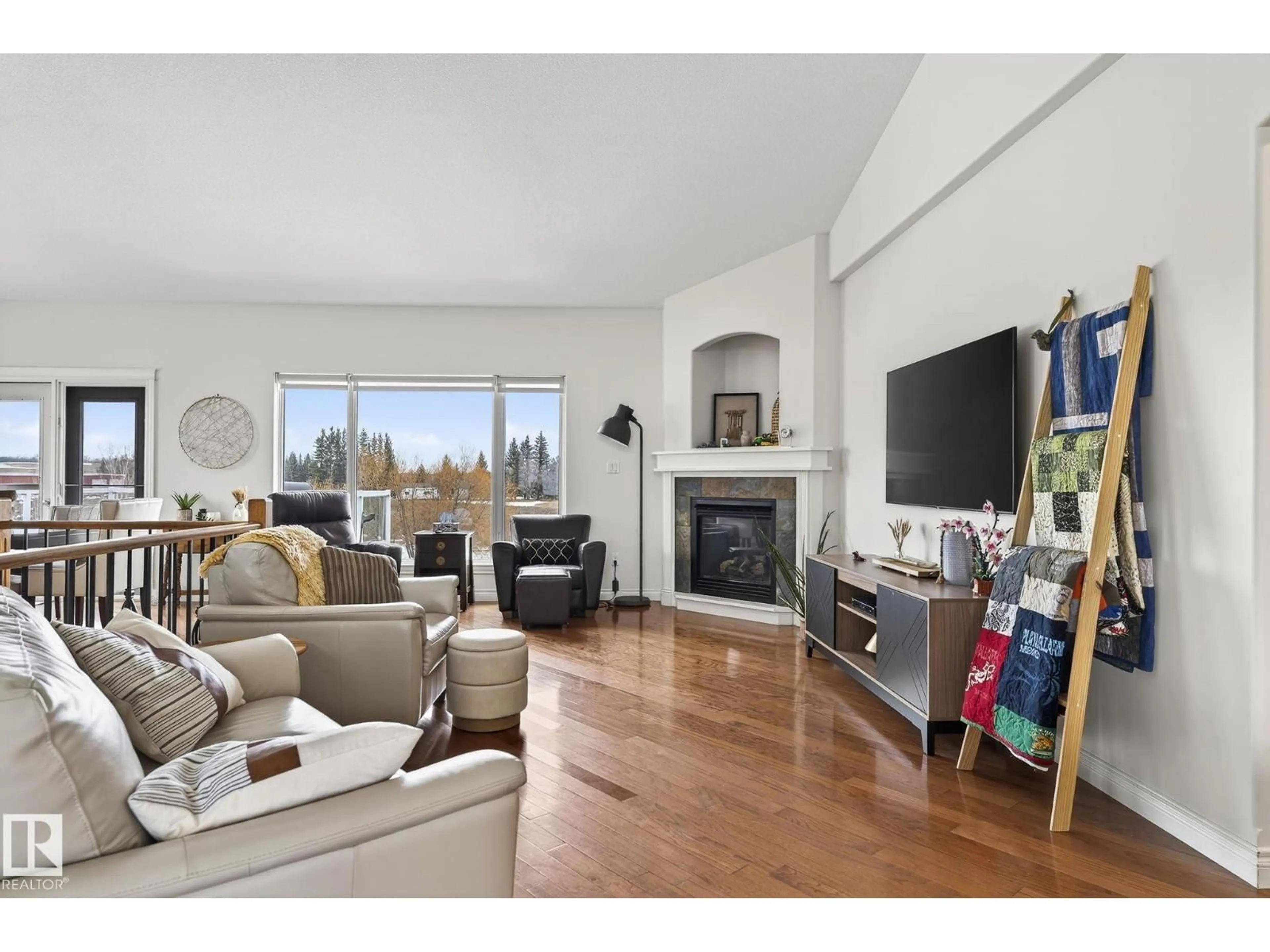 Living room with furniture, wood/laminate floor for #3 - 27314 TWP ROAD 534, Rural Parkland County Alberta T7X3R9